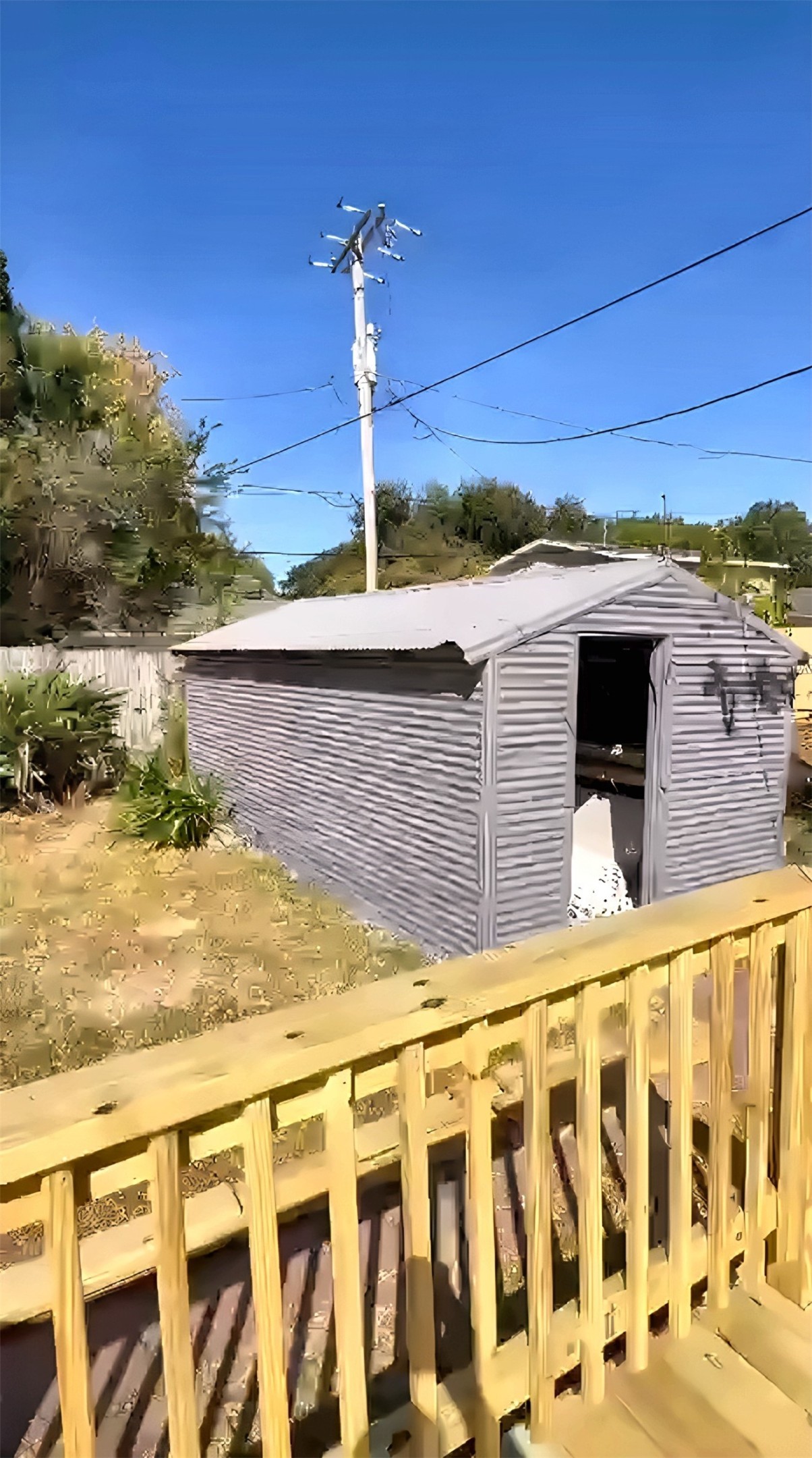 Backyard with storage shed and deck