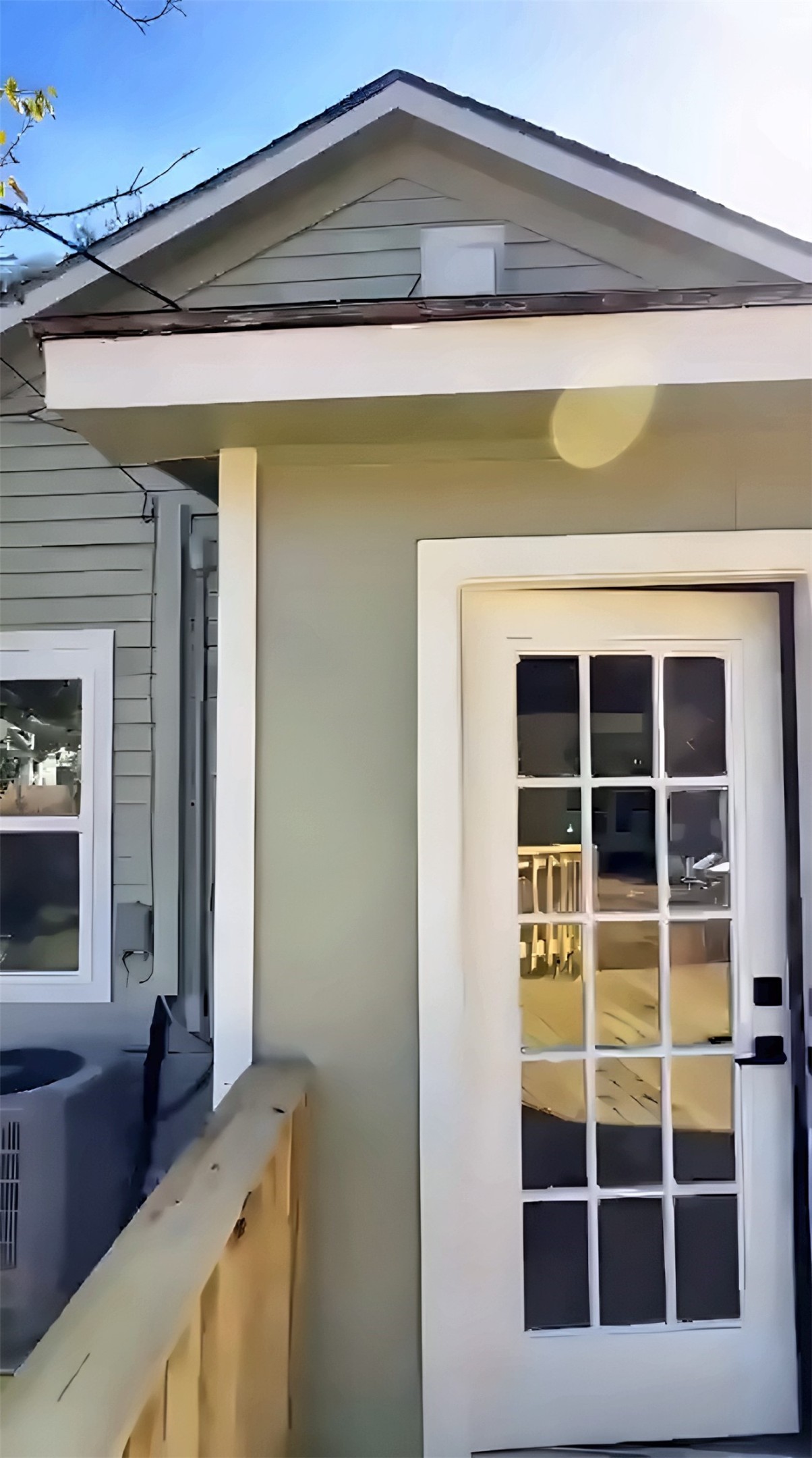 Exterior door with glass panes and porch