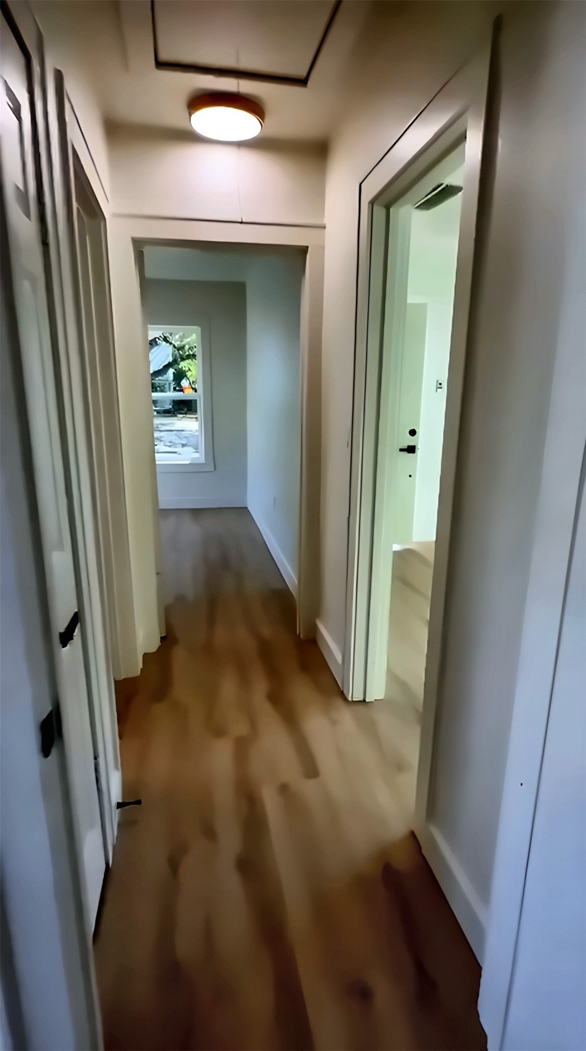 Hallway with wood-look flooring