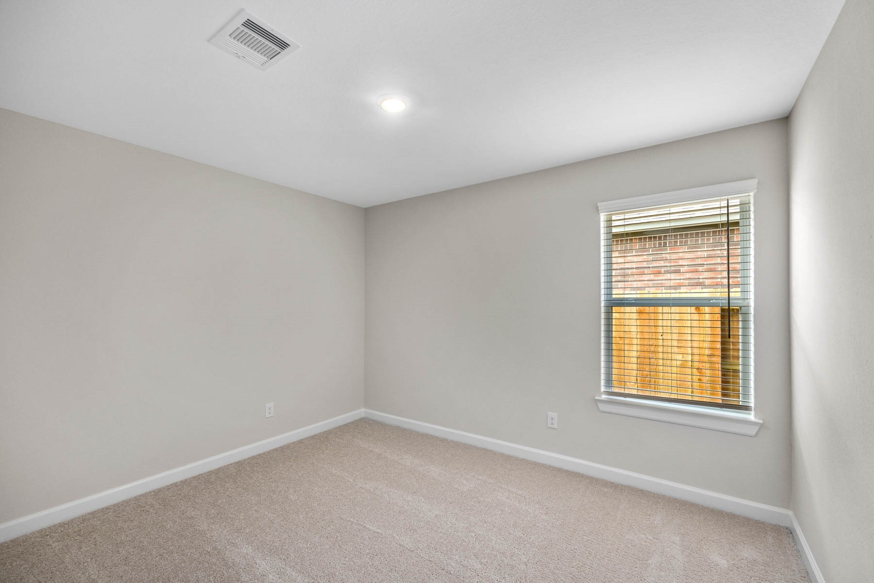 The secondary bedrooms are both of generous size and feature large closets.