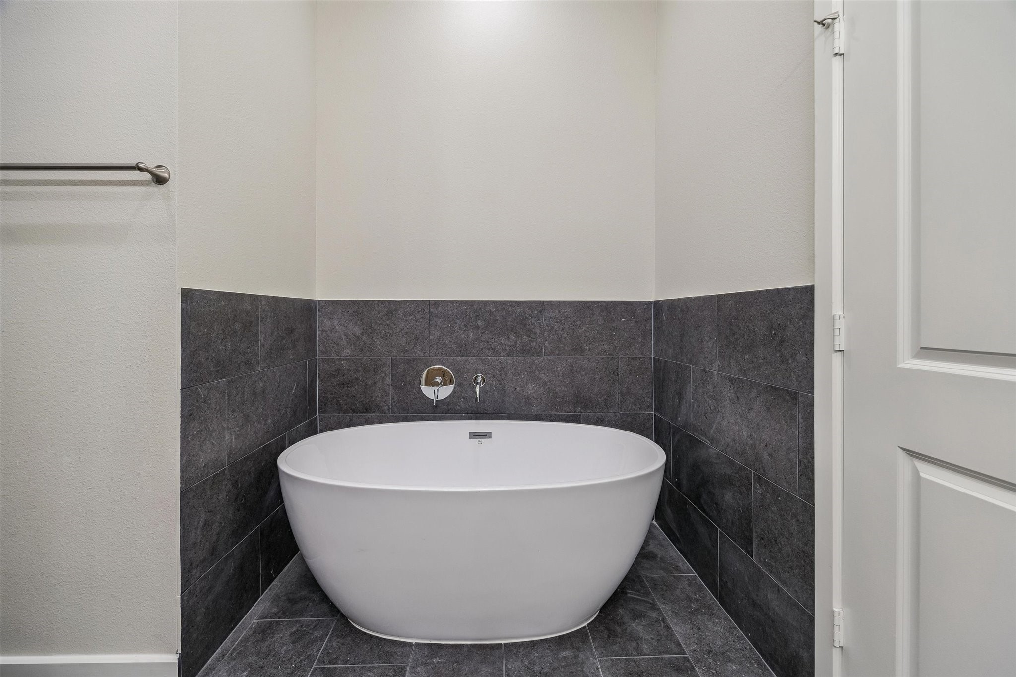 Primary bathroom's floating tub