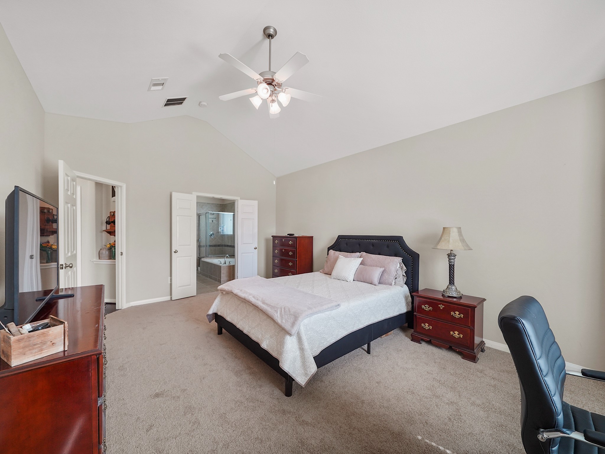 Plush carpeting brings a cozy touch to the spacious primary bedroom, creating a comfortable retreat from the pace of the day. Theres room to make this space your own and settle in for a restful evening.