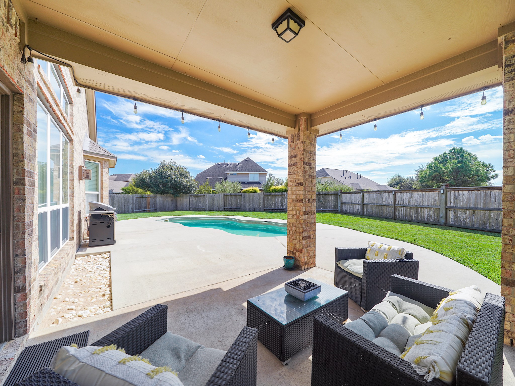 The covered patio offers a comfortable spot to enjoy the outdoors, whether youre sipping your morning coffee or gathering with guests for dinner. Take in the backyard and settle into a little shade while enjoying time at home.
