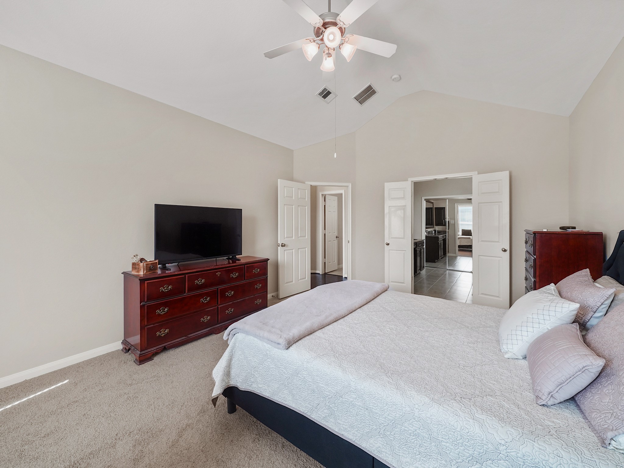 The primary retreat connects directly to its ensuite bathroom, bringing ease and convenience to your daily routine. Enjoy a quiet space to get ready in the morning or settle in for the evening, with the bath just steps away.