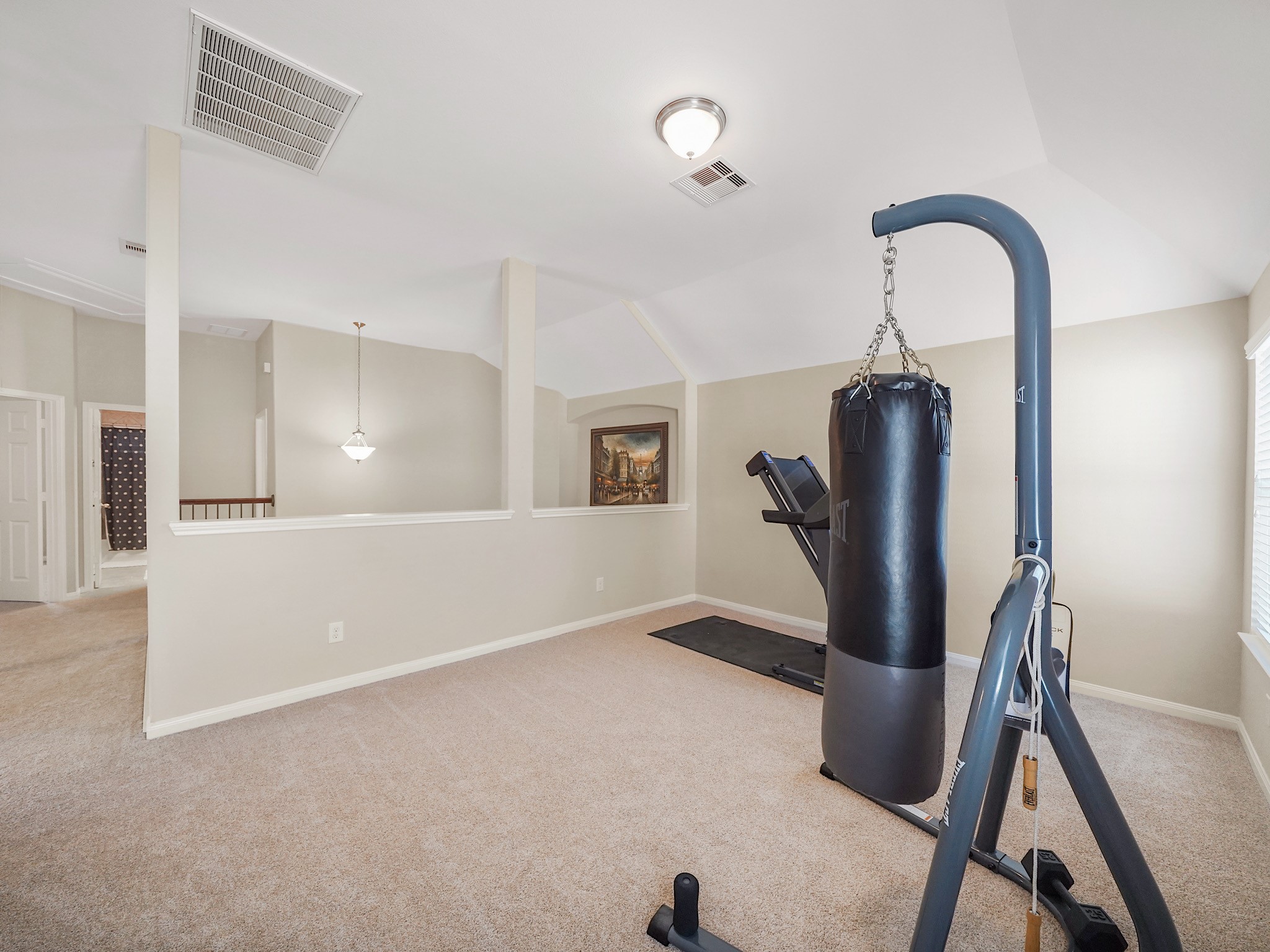 The upstairs game room offers flexibility to fit the way you live. Create a casual second living area, a space for hobbies, exercise room, or a comfortable retreat where everyone can relax and enjoy their favorite activities.