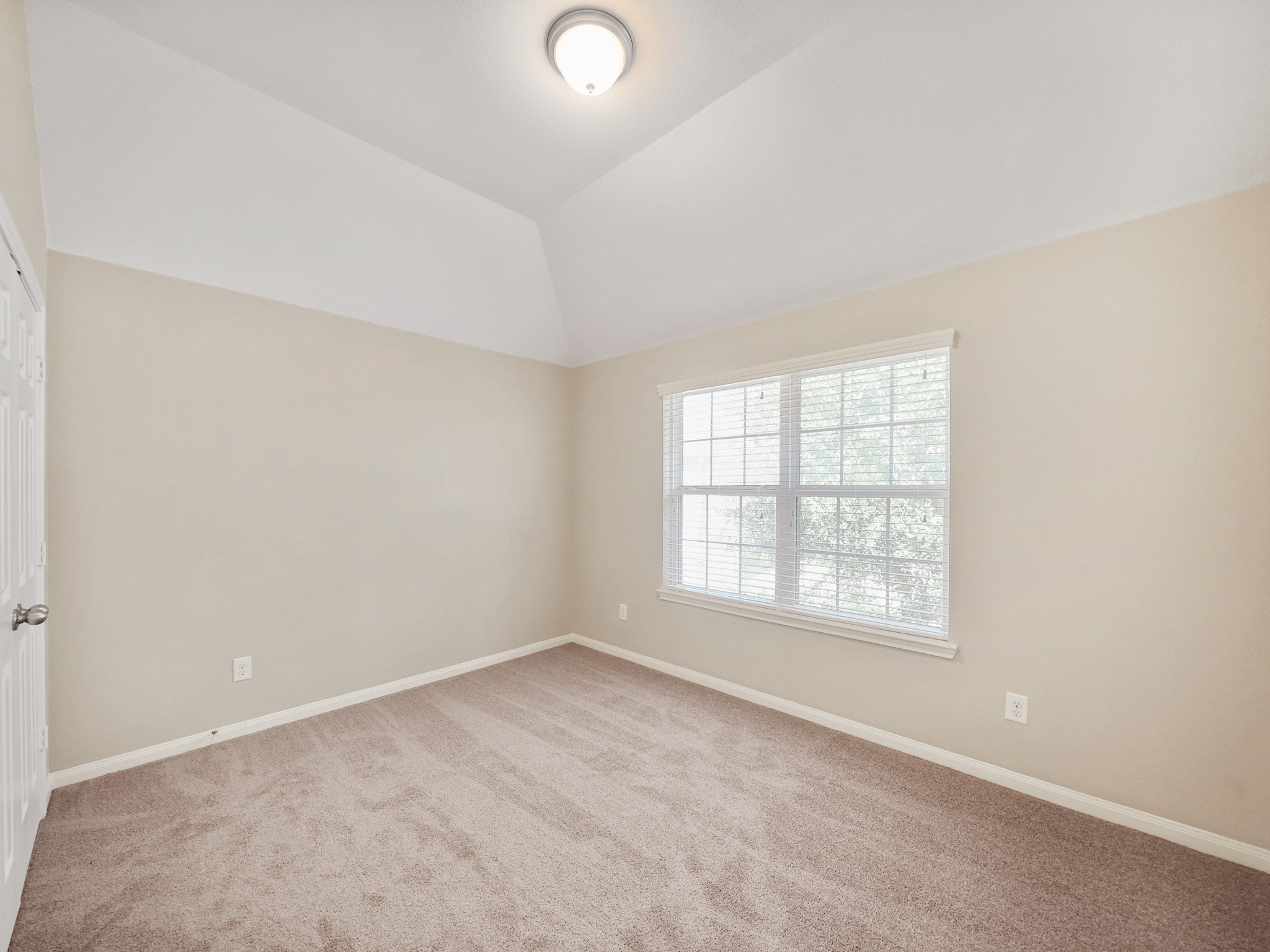 This upstairs secondary bedroom offers a welcoming place to relax and recharge. Make it your own with a style that feels comfortable and personal, creating a retreat to enjoy at the end of the day.