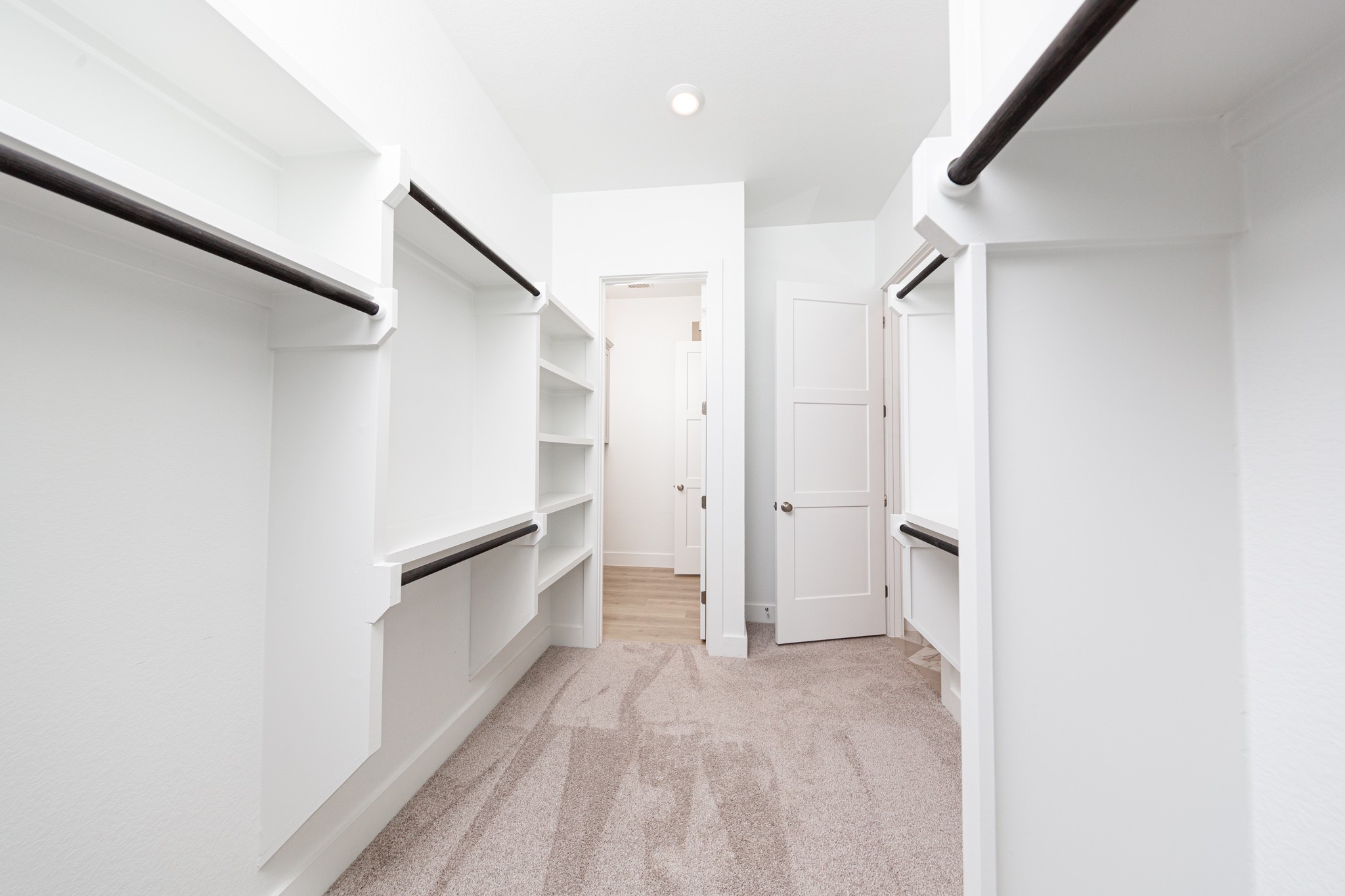 Look at this immaculate closet! With high shelving, multiple rows to hang clothing, you are sure to have enough room for all your belongings!