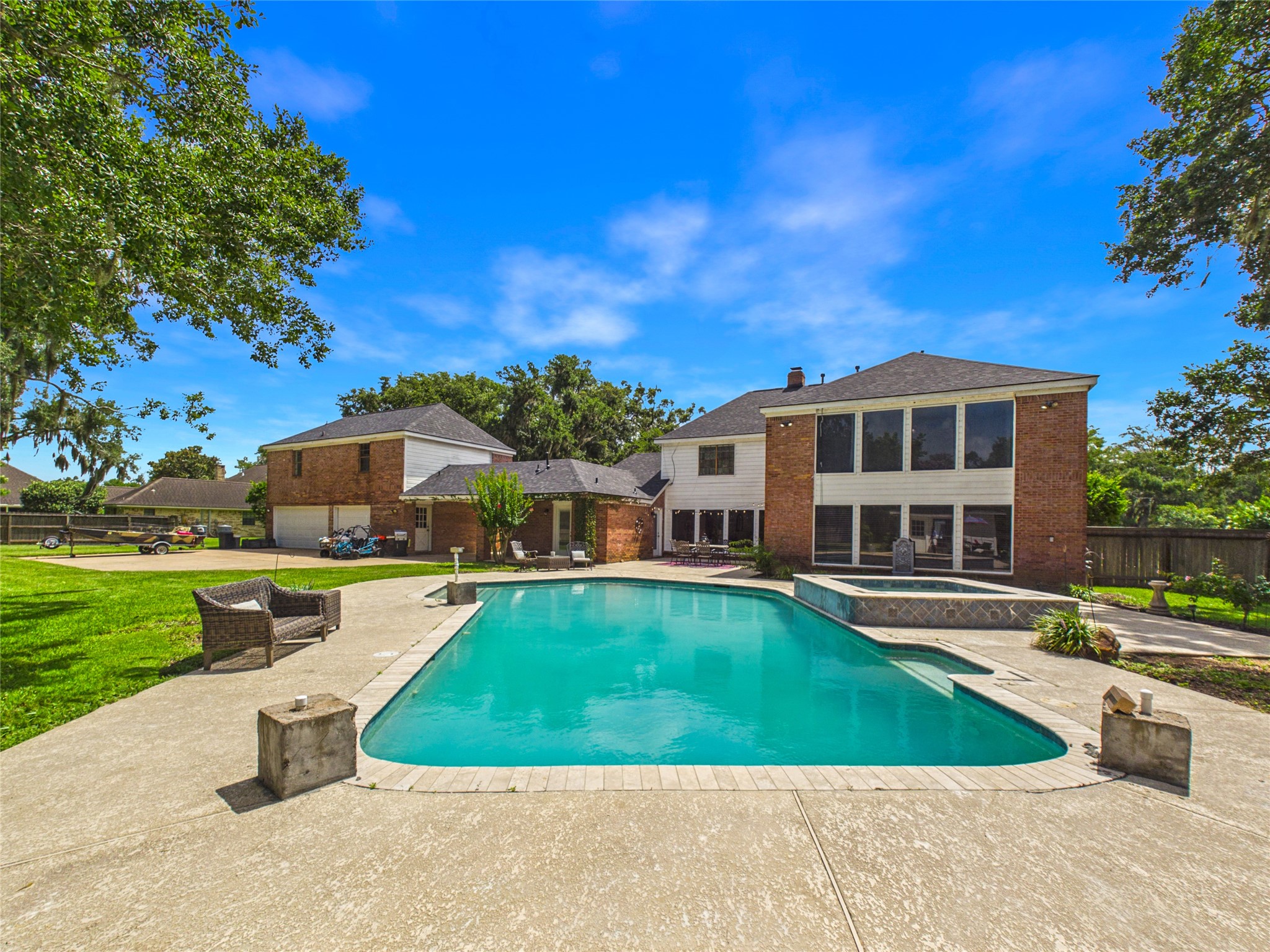 Large pool and maure trees in large backyard