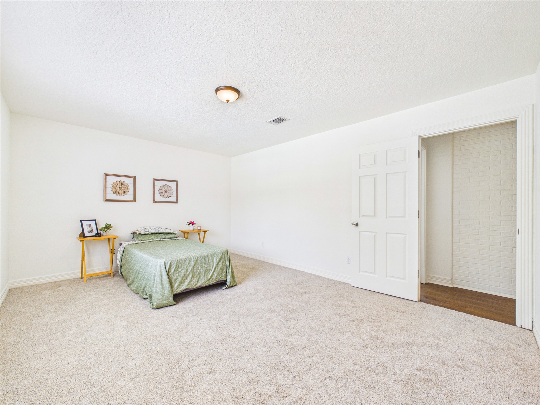 Secondary bedroom from corner with large walk-in closet