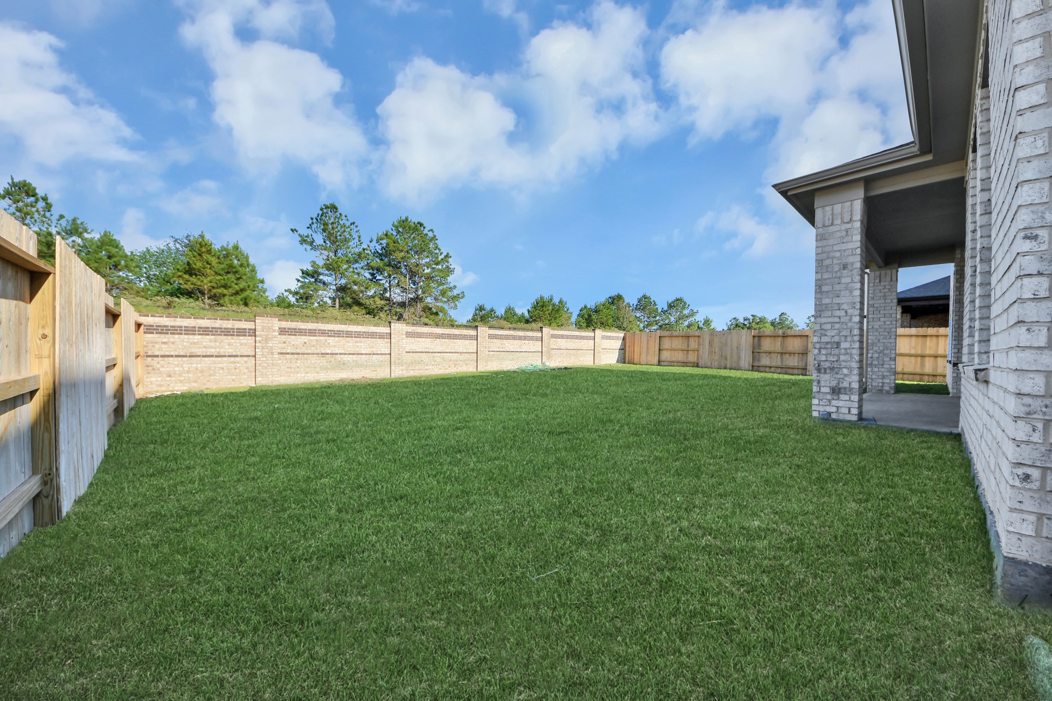 Explore the expansive backyard with its inviting covered patioa perfect blend of space for the kids to play and adults to unwind. Ideal for creating your outdoor oasis, this backyard accommodates patio furniture, a BBQ pit, and endless possibilities for leisure and entertainment.