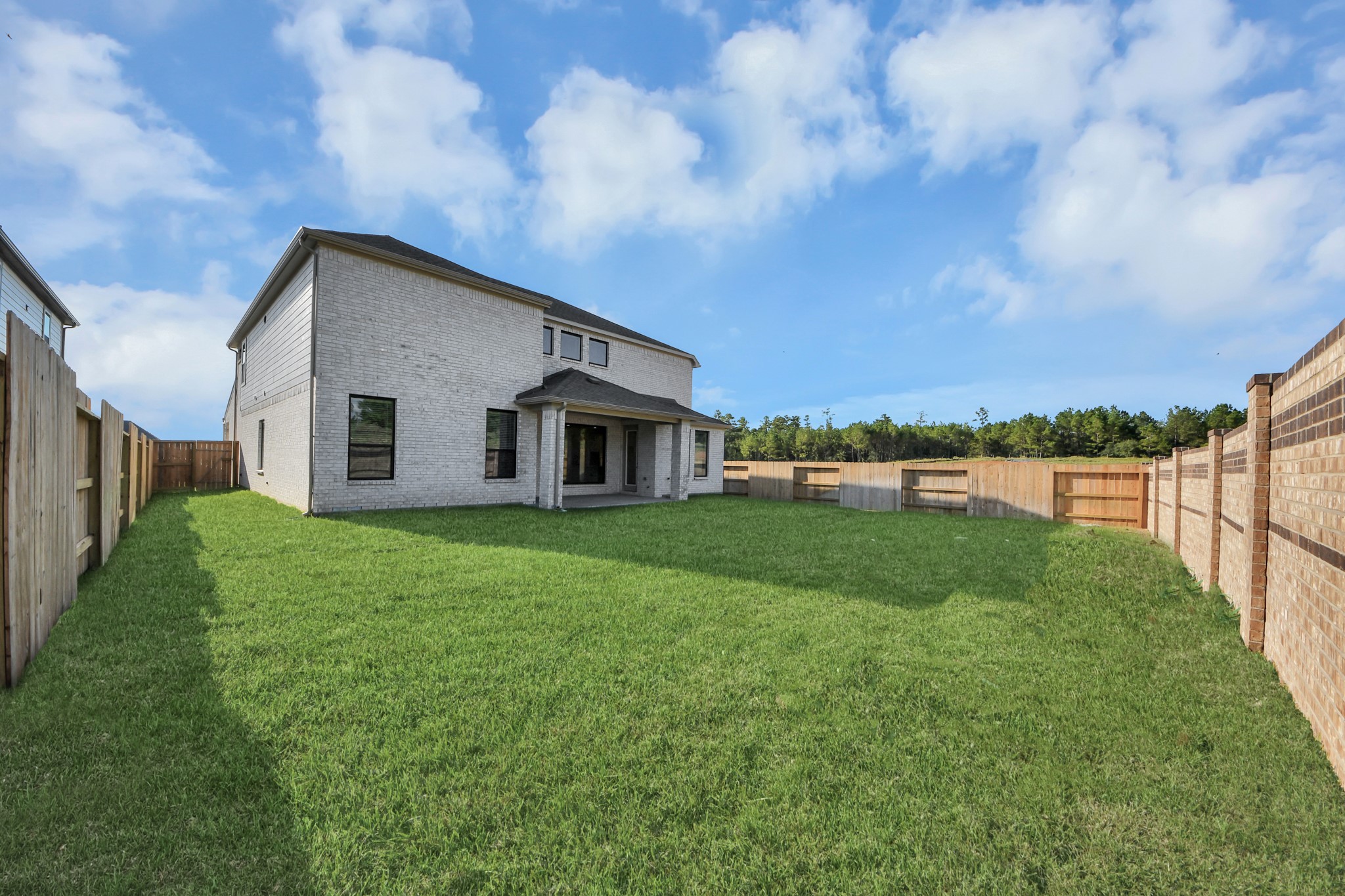 Come and see this spacious backyard with its beautiful covered patio. There is plenty of room for the kids to play and adults to relax. Perfect for your outdoor living space, patio furniture, bbq pit, and so much more. The possibilities are endless!