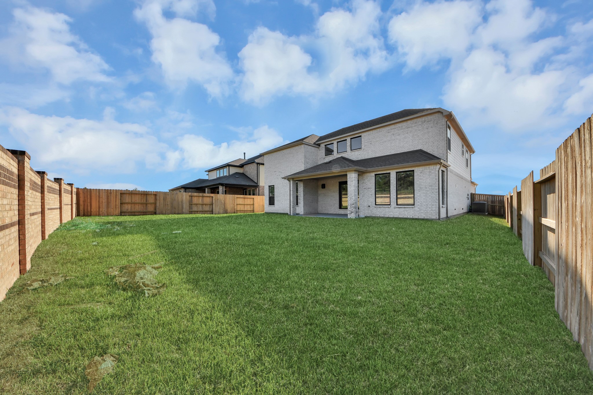 Come and see this spacious backyard with its beautiful covered patio. There is plenty of room for the kids to play and adults to relax. Perfect for your outdoor living space, patio furniture, bbq pit, and so much more. The possibilities are endless!