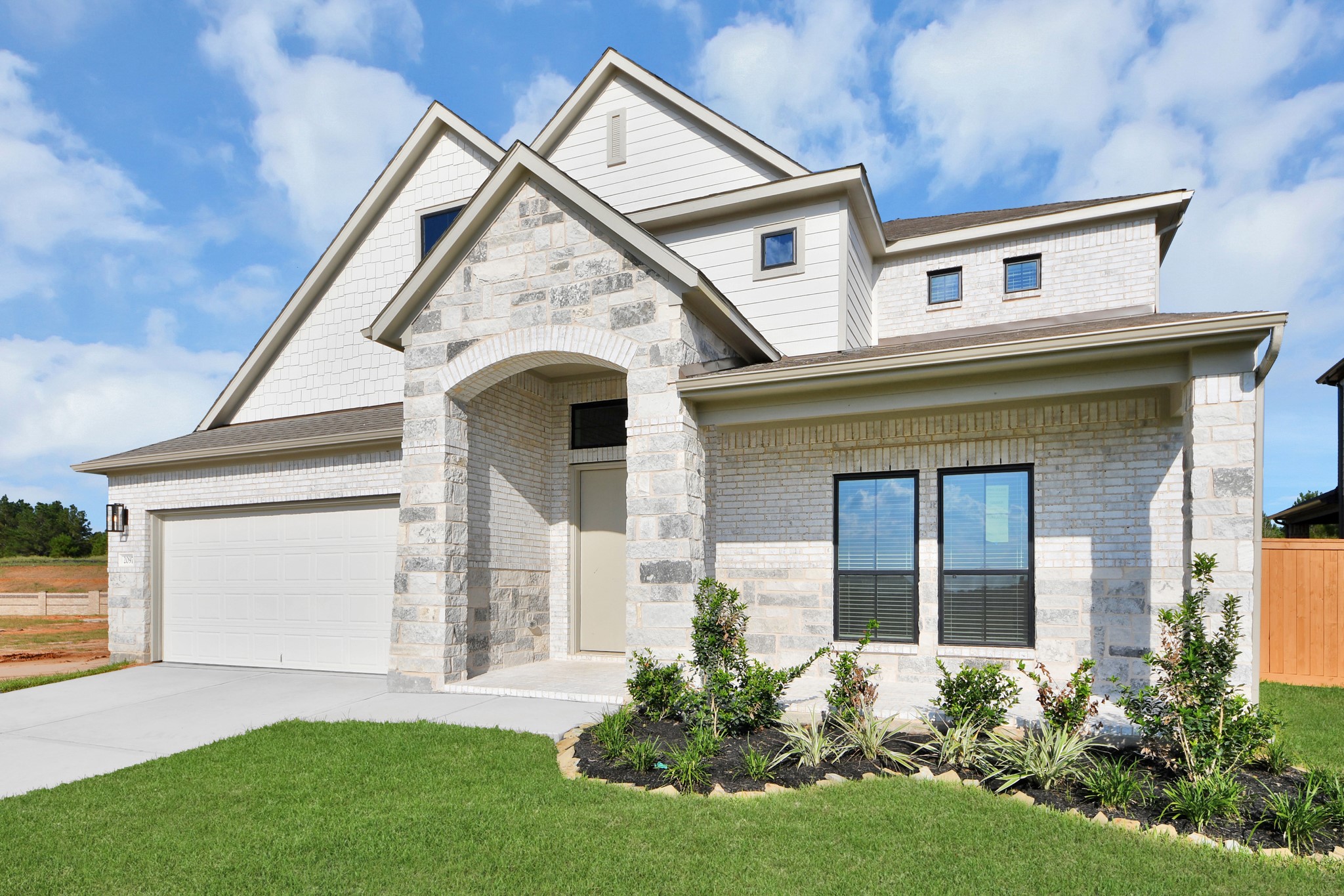 Home features a convenient 2-car garage complemented by a spacious driveway, offering ample parking for you and your guests. Home features a convenient 2-car garage complemented by a spacious driveway, offering ample parking for you and your guests.