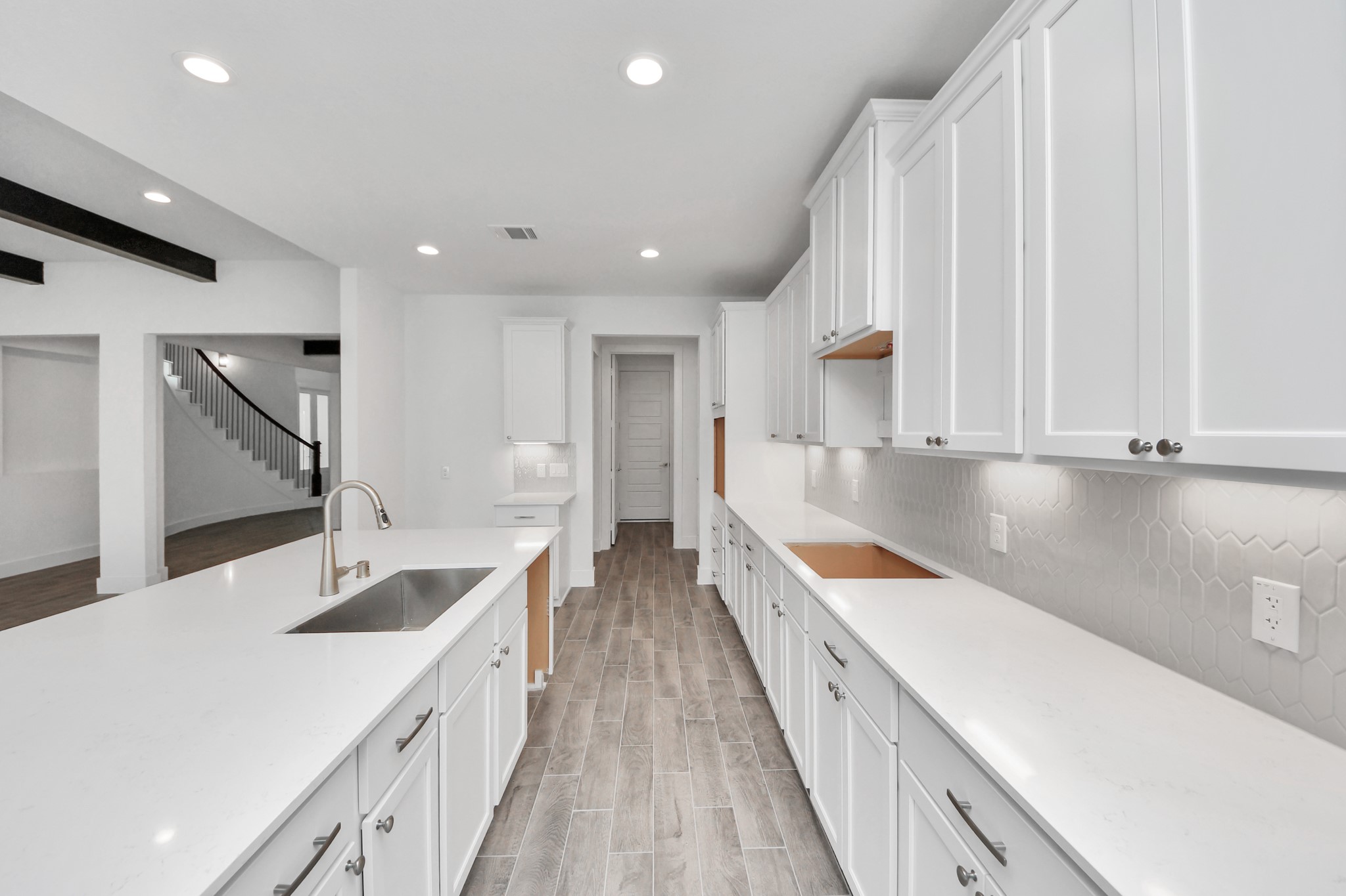 All of this overlooks your expansive family room, creating a perfect space for culinary delights and family gatherings.