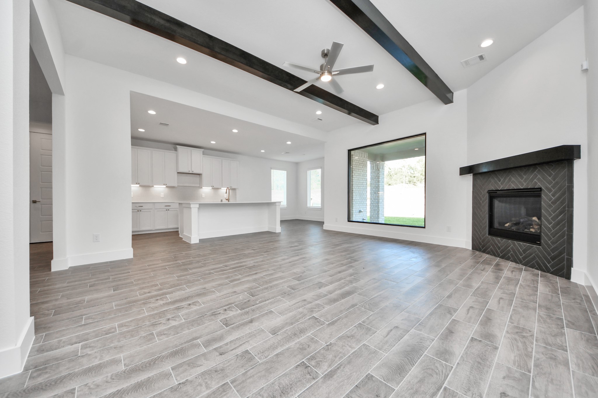 Take another glimpse into the heart of the home with this additional view of the family rooma sprawling space ready to accommodate all your gatherings.