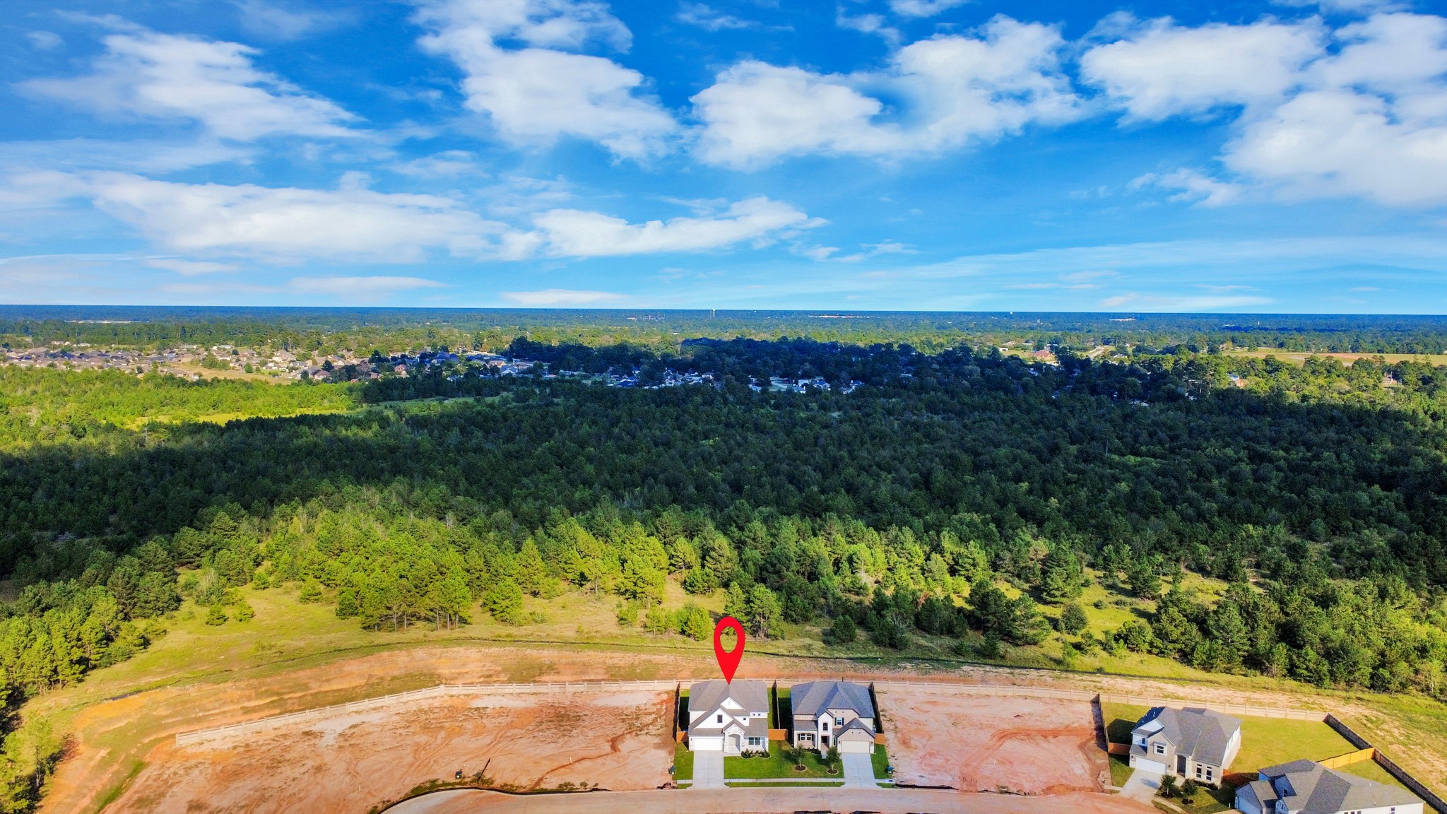 An aerial view of a spacious subdivision lot, highlighting a well-maintained yard and a fully fenced perimeter, offering both privacy and expansive outdoor space. An aerial view of a spacious subdivision lot, highlighting a well-maintained yard and a fully fenced perimeter, offering both privacy and expansive outdoor space.