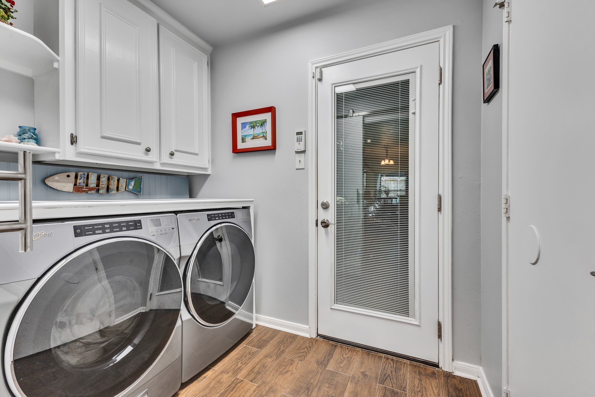 Laundry room just off the kitchen, and walk out to the garage.