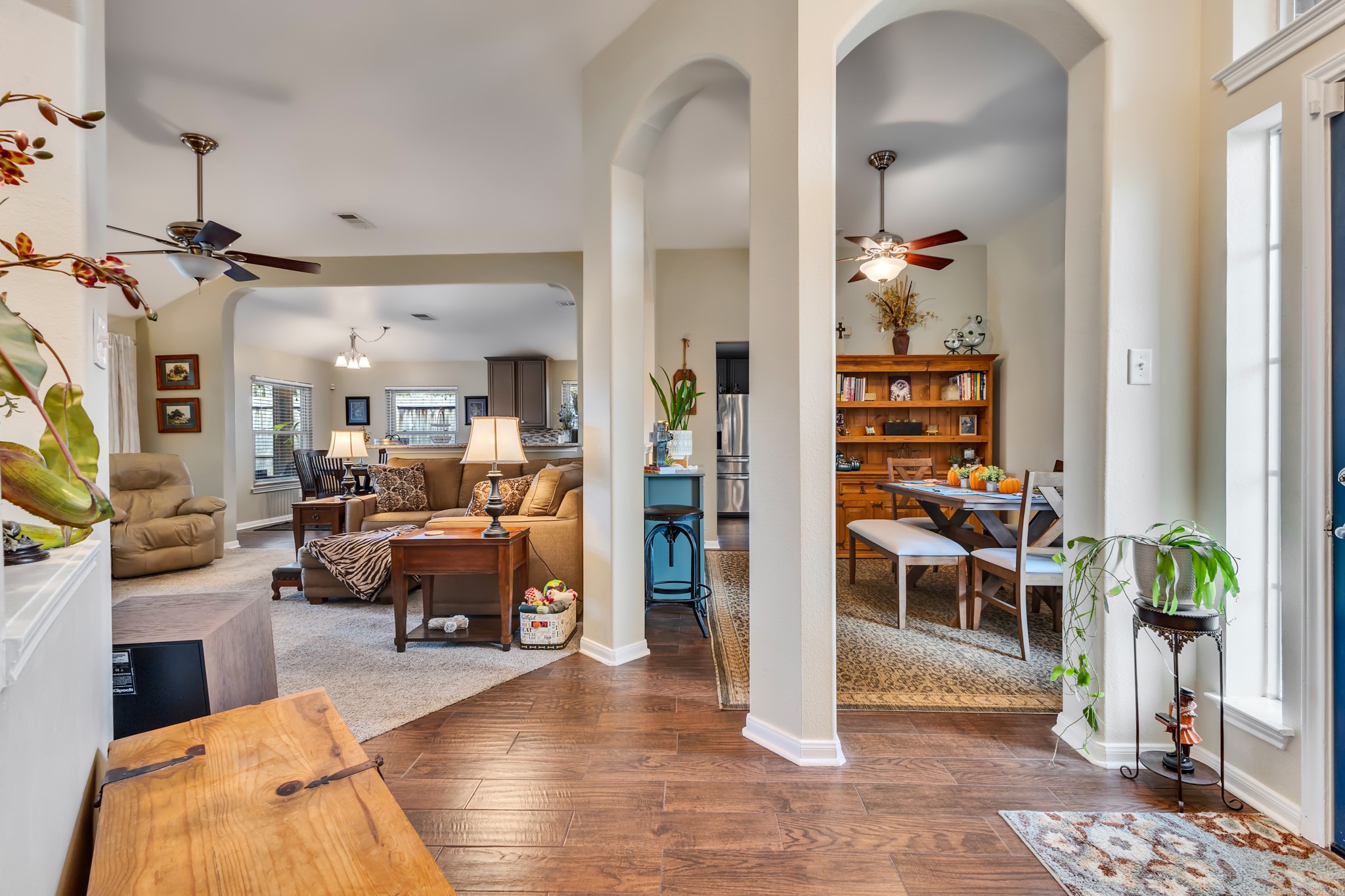 View of the dining room and living room with breakfast eat in area in the back.