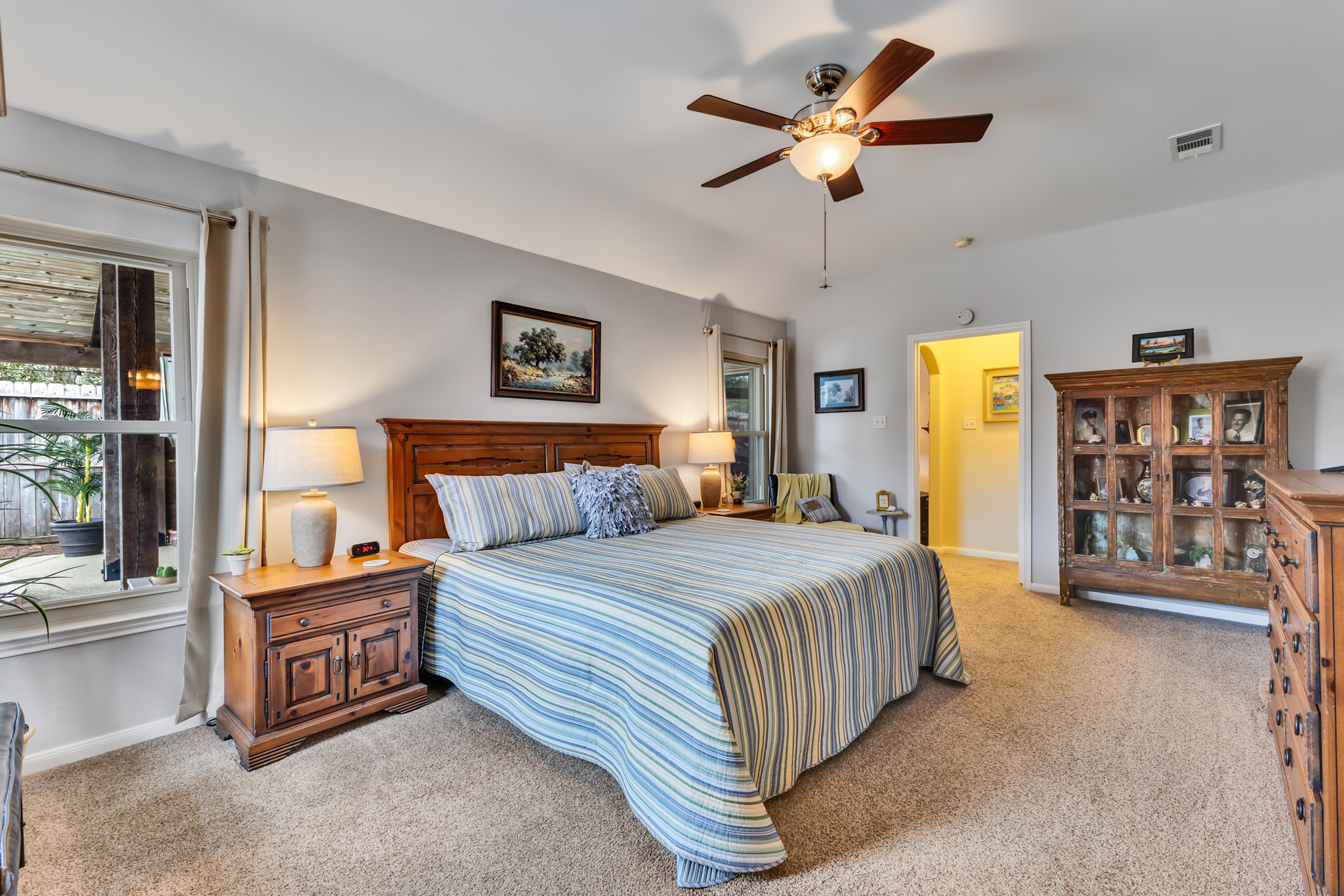 Primary bedroom is at the back of the home and separate from the other two bedrooms.