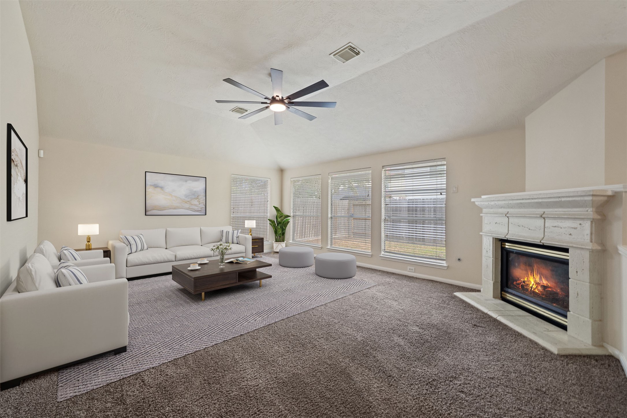 Spacious and inviting living room with abundant natural light and a cozy fireplace, offering a perfect blend of comfort and modern elegance. *virtually staged Spacious and inviting living room with abundant natural light and a cozy fireplace, offering a perfect blend of comfort and modern elegance. *virtually staged