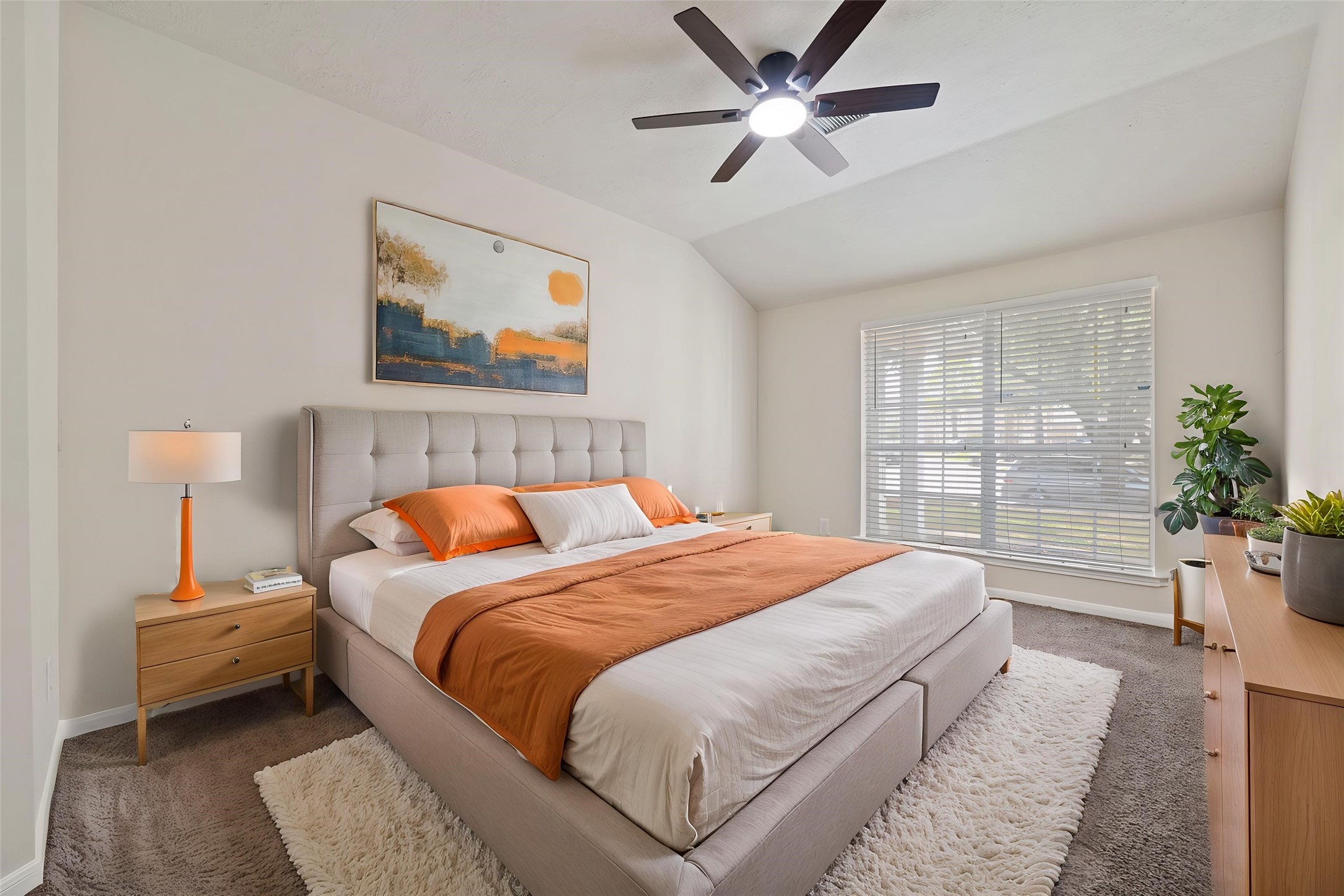 4th bedroom featuring a modern ceiling fan and abundant natural light streaming through a large window. *virtually staged