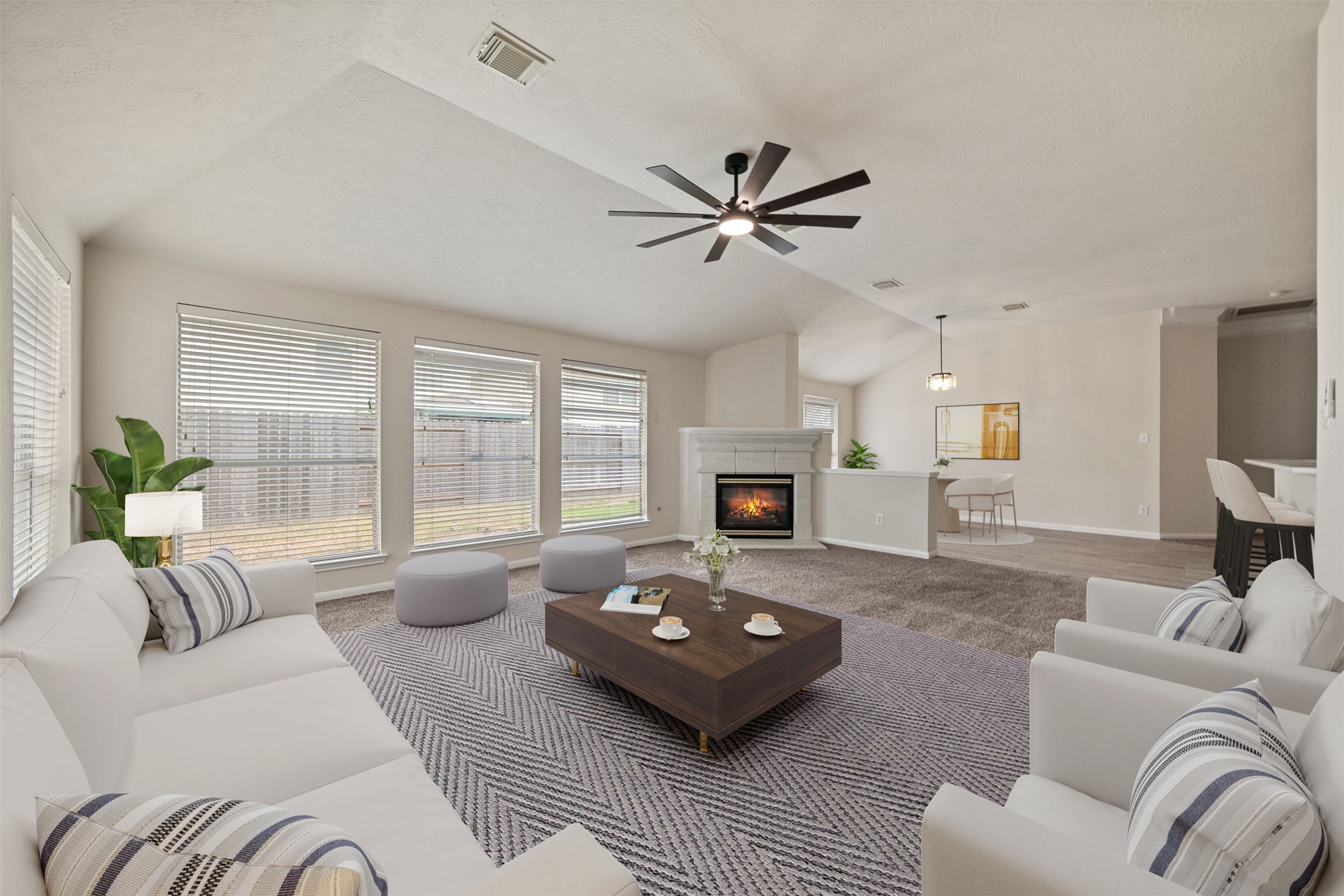 Huge den with abundant natural light, a fireplace, perfect for relaxation and entertaining. *virtually staged