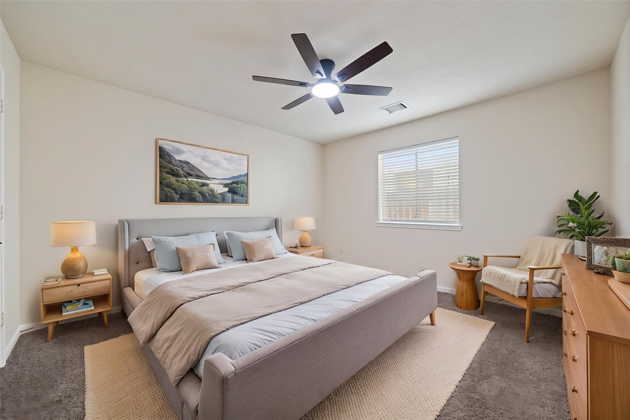 3rd bedroom featuring a modern ceiling fan and ample natural light. *virtually staged
