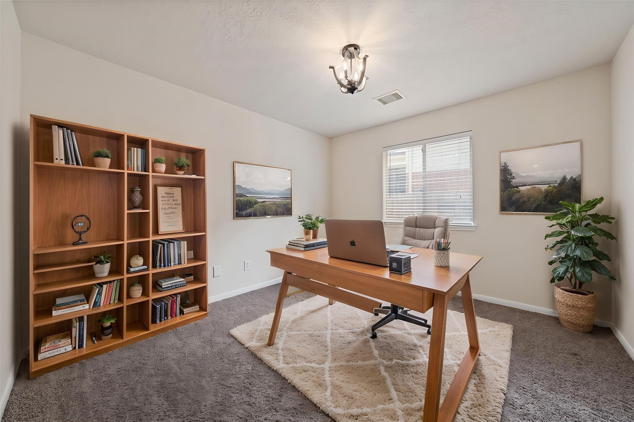 Sunlit home office perfect for productivity and inspiration for remote work or study space. *virtually staged