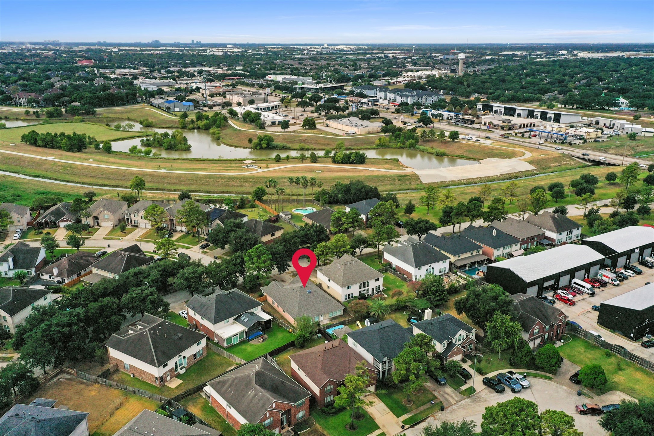 Charming neighborhood setting with well-maintained homes, surrounded by lush greenery, offering a serene suburban lifestyle with convenient access to local amenities.