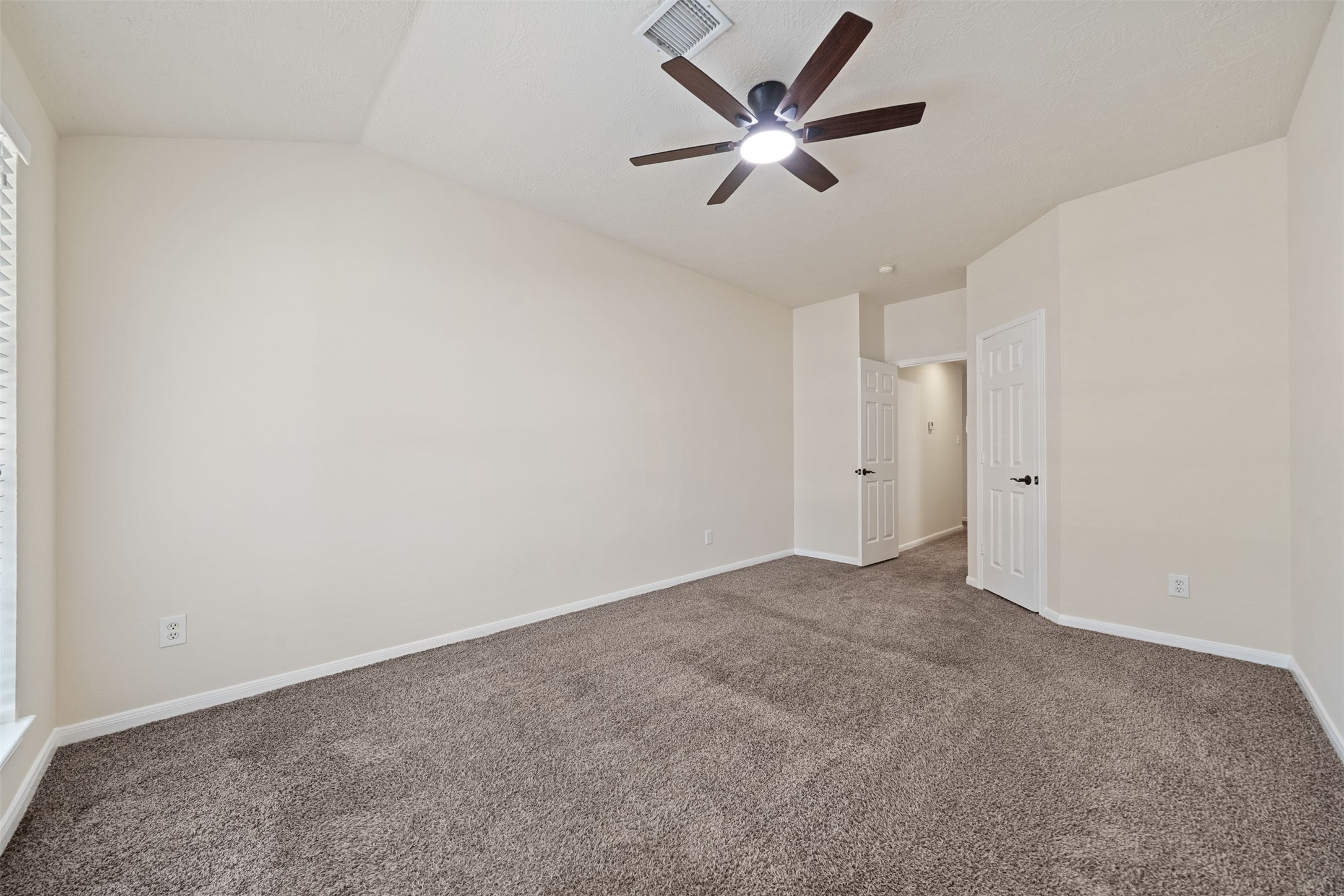 Also features plush carpet, neutral walls, and a walk-in closet
