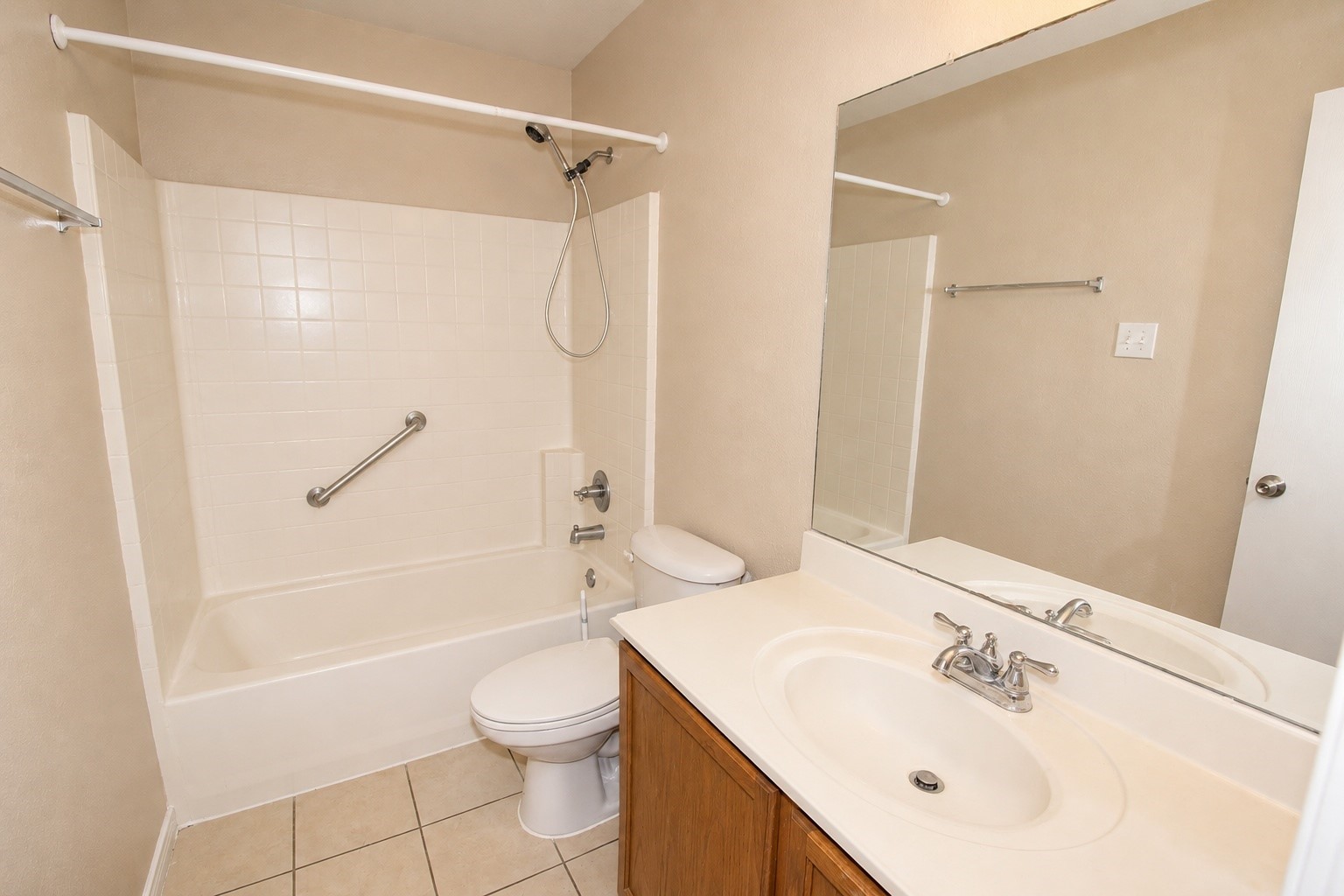 Secondary bath features a shower/tub combo