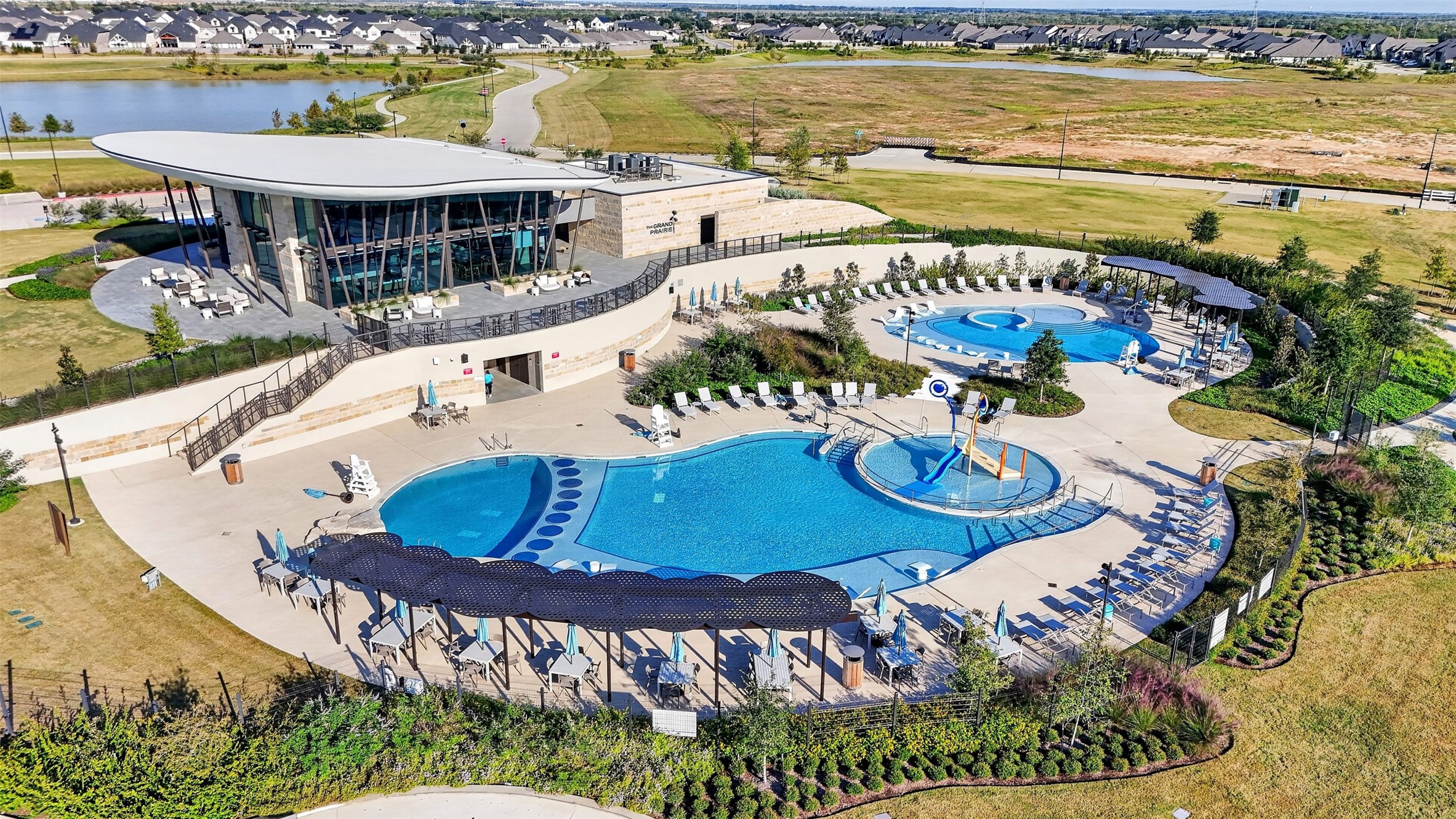 Resort-Style Community Amenities: Experience resort-inspired living with expansive swimming pools, splash features, poolside lounging areas, and a stunning clubhouse overlooking the community's scenic landscape.