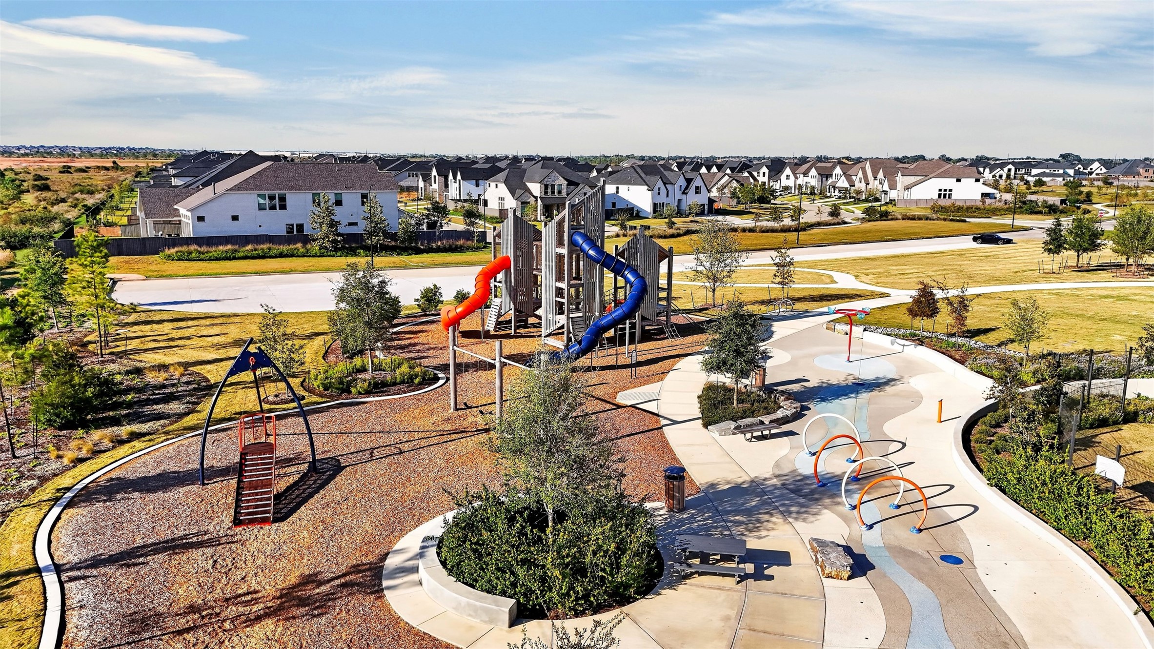 Community Playground & Splash Pad: Enjoy beautifully designed outdoor recreation areas featuring colorful playground equipment, winding slides, an interactive splash pad, and inviting gathering spaces.