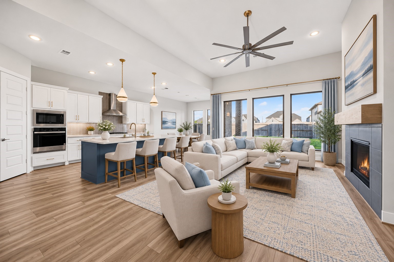 Spacious Living Room & Kitchen: Soaring ceilings, expansive windows, and a striking fireplace create an inviting living space that flows effortlessly into the gourmet kitchen and dining areaideal for everyday living and entertaining.
