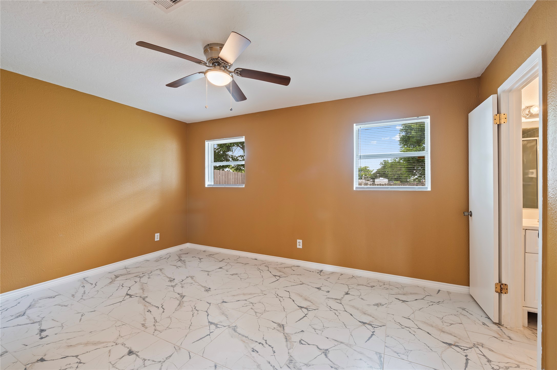 Third downstairs secondary bedroom with full ensuite bathroom