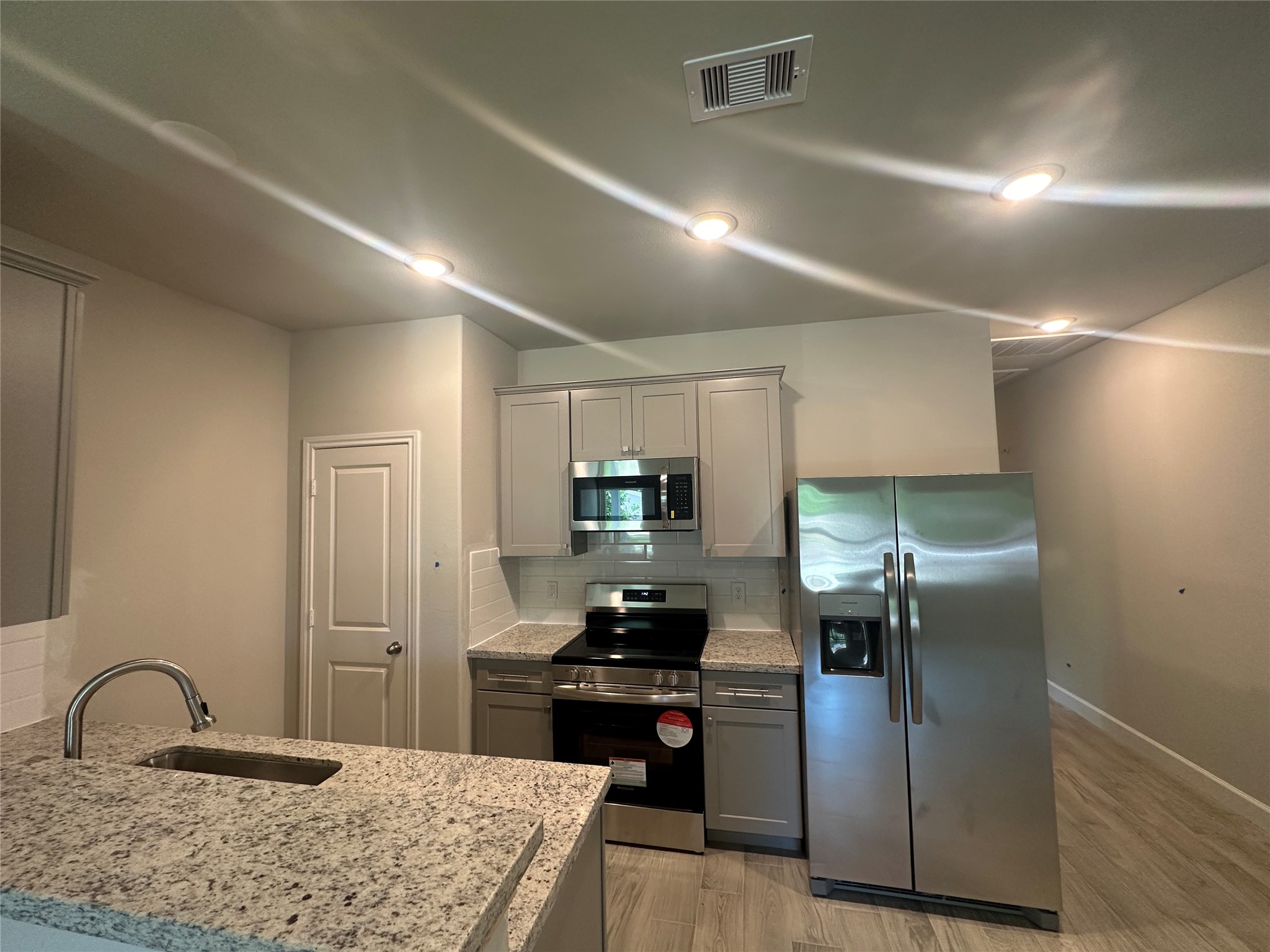 Unit A; open flow kitchen with large pantry and plenty of cabinet storage.