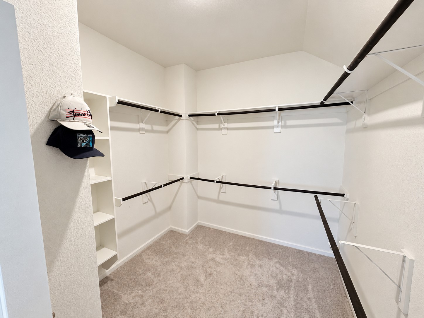 10. Walk-in closet with wraparound shelving and hanging space.