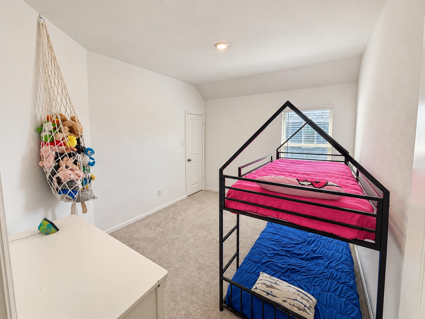 11. Secondary bedroom shown with bunk beds and space for additional furnishings.