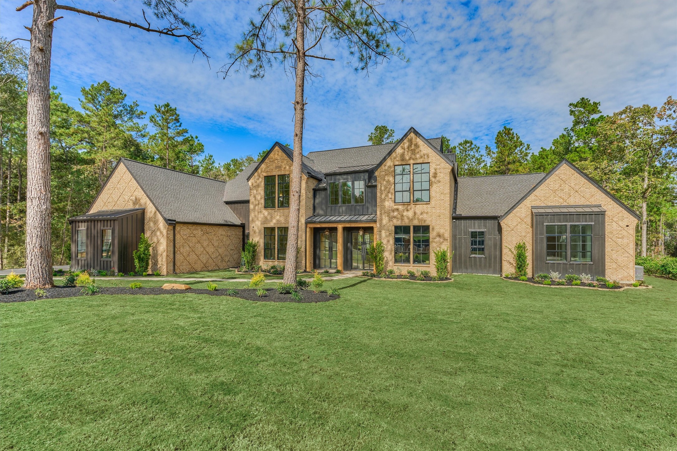 The homes impressive front elevation, highlighting it's premium exterior finishes and welcoming entry designed to make a lasting impression.