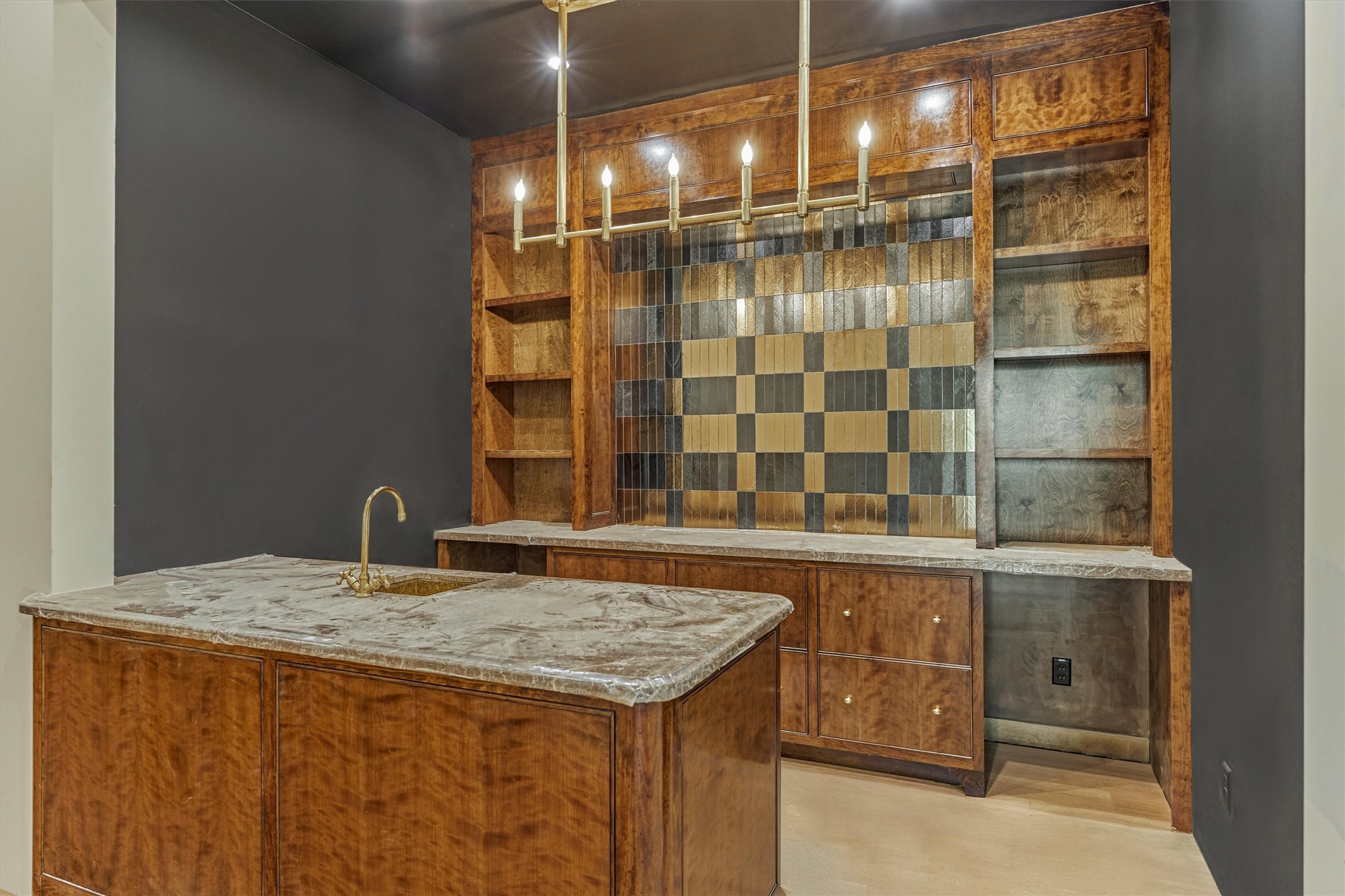 A sophisticated, dedicated wet bar featuring exquisite cabinetry, positioned for effortless entertaining and refined gatherings.