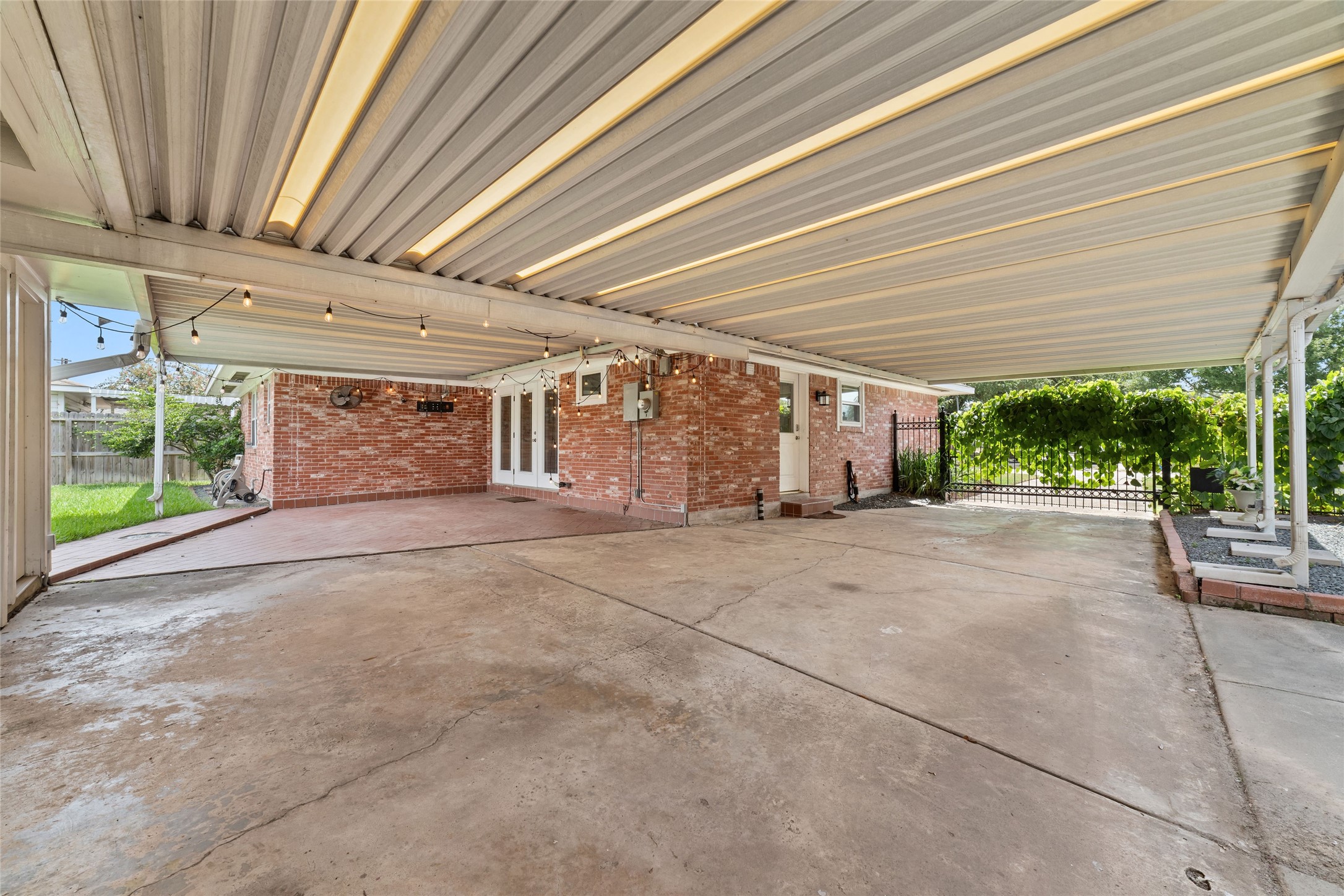 A driveway with an automatic gate provides added security and privacy.