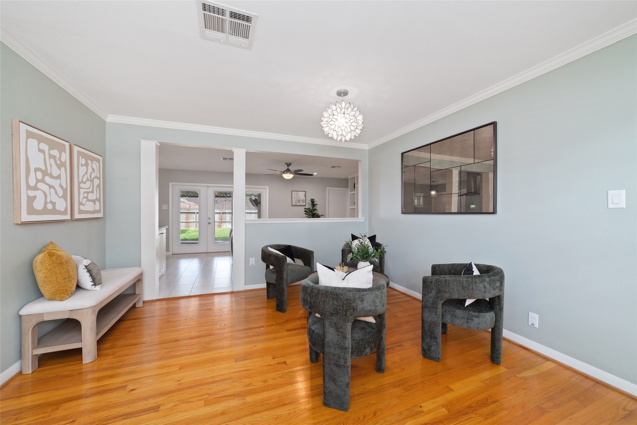 Den area has an open flow into the adjacent living and dining areas. Perfect for comfortable gatherings and effortless entertaining.