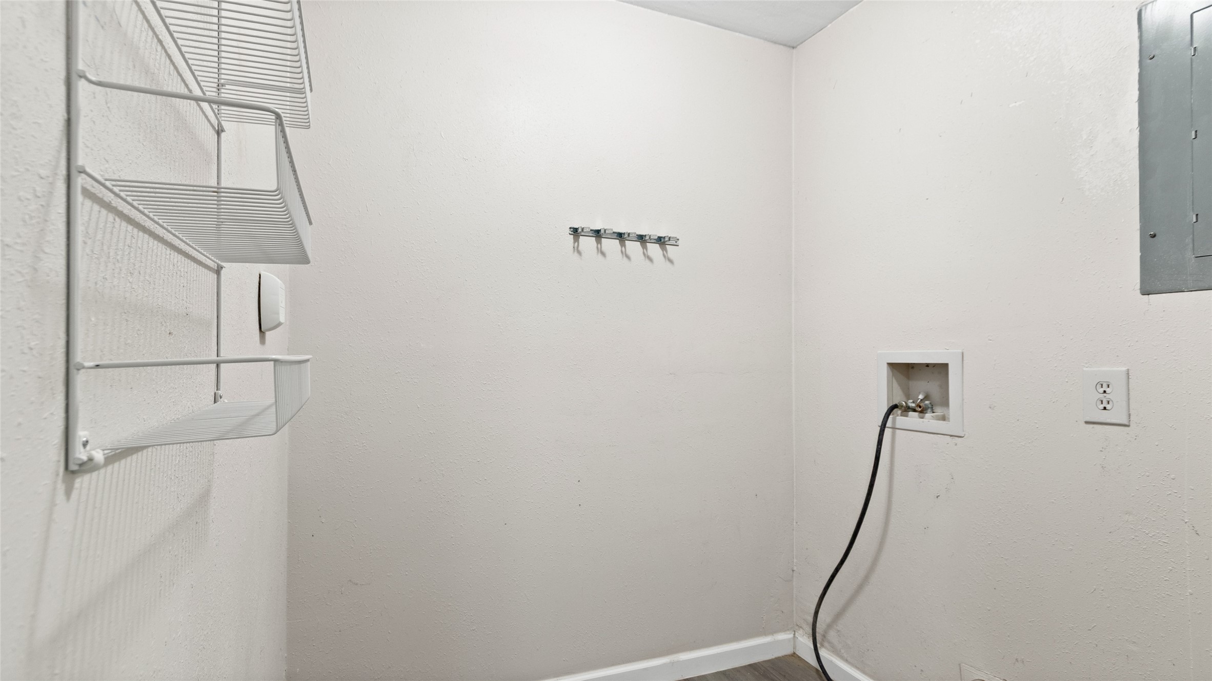 Laundry room in converted garage apartment