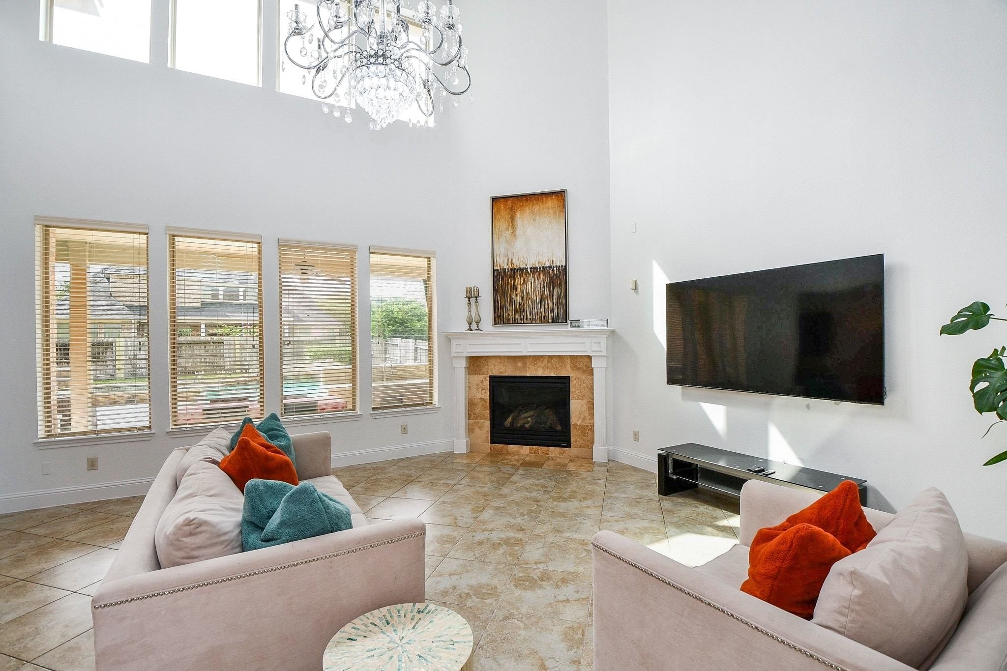 2 Story living area with gas log fireplace.