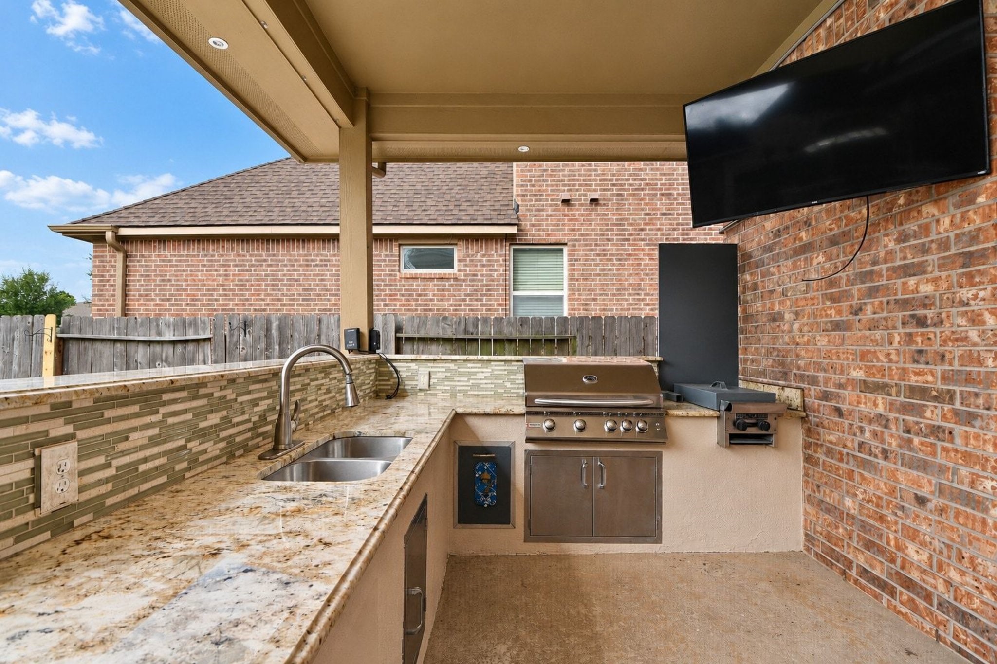 Great Outdoor Kitchen and covered patio area.