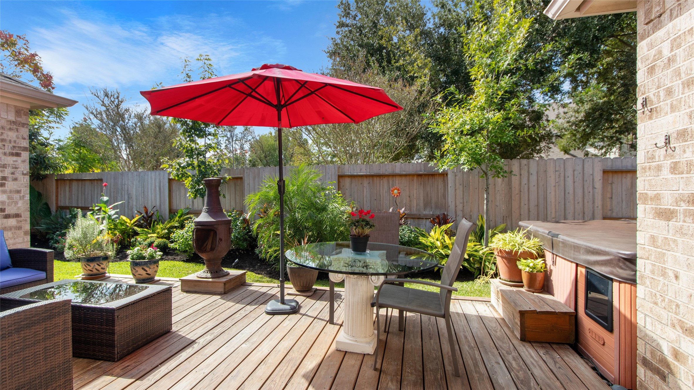 Step onto your back deck and enjoy the beautiful landscaping.