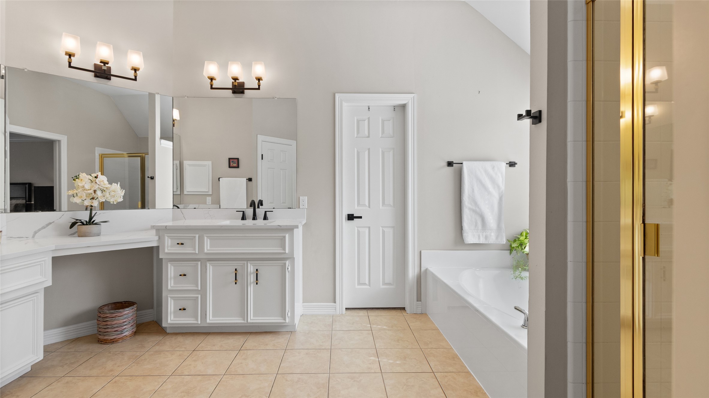 The Primary Bathroom has dual vanities, a jetted tub, and a separate shower.