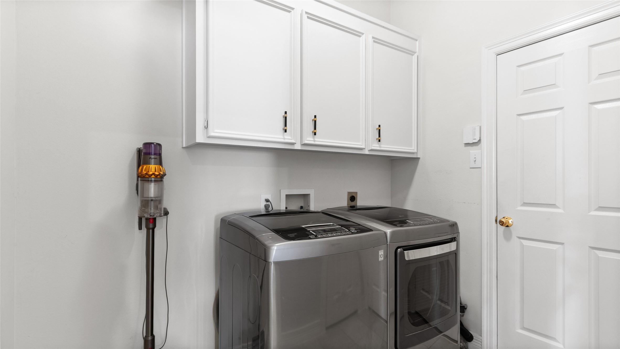 Laundry room off of the kitchen, leads to the garage.