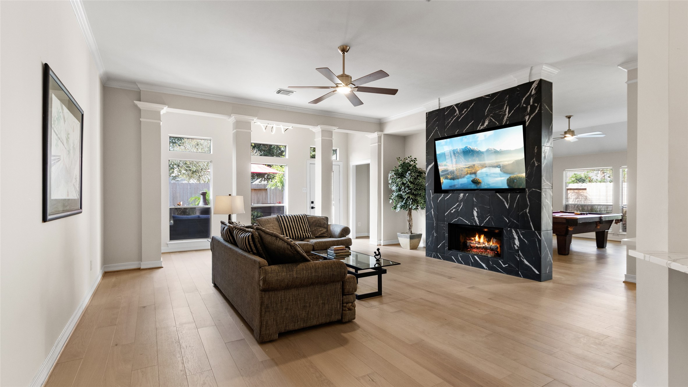 The spacious Family Room has loads of natural light.  The TV comes with the house.