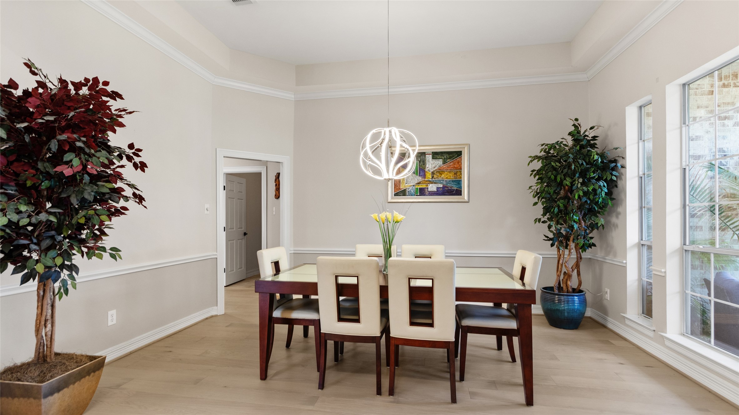 Dining room to the right of the entry, with access into the kitchen as well.